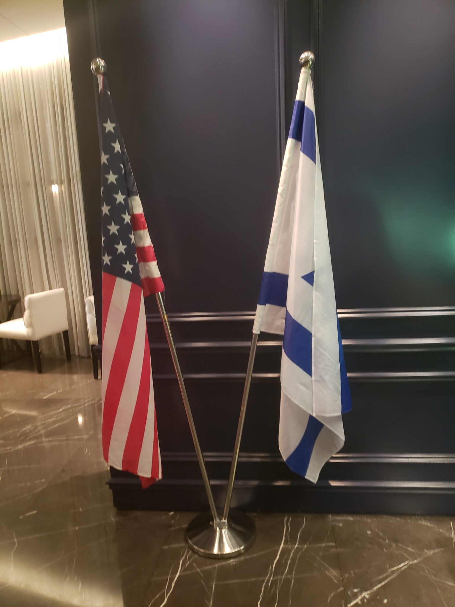two flags on a pole