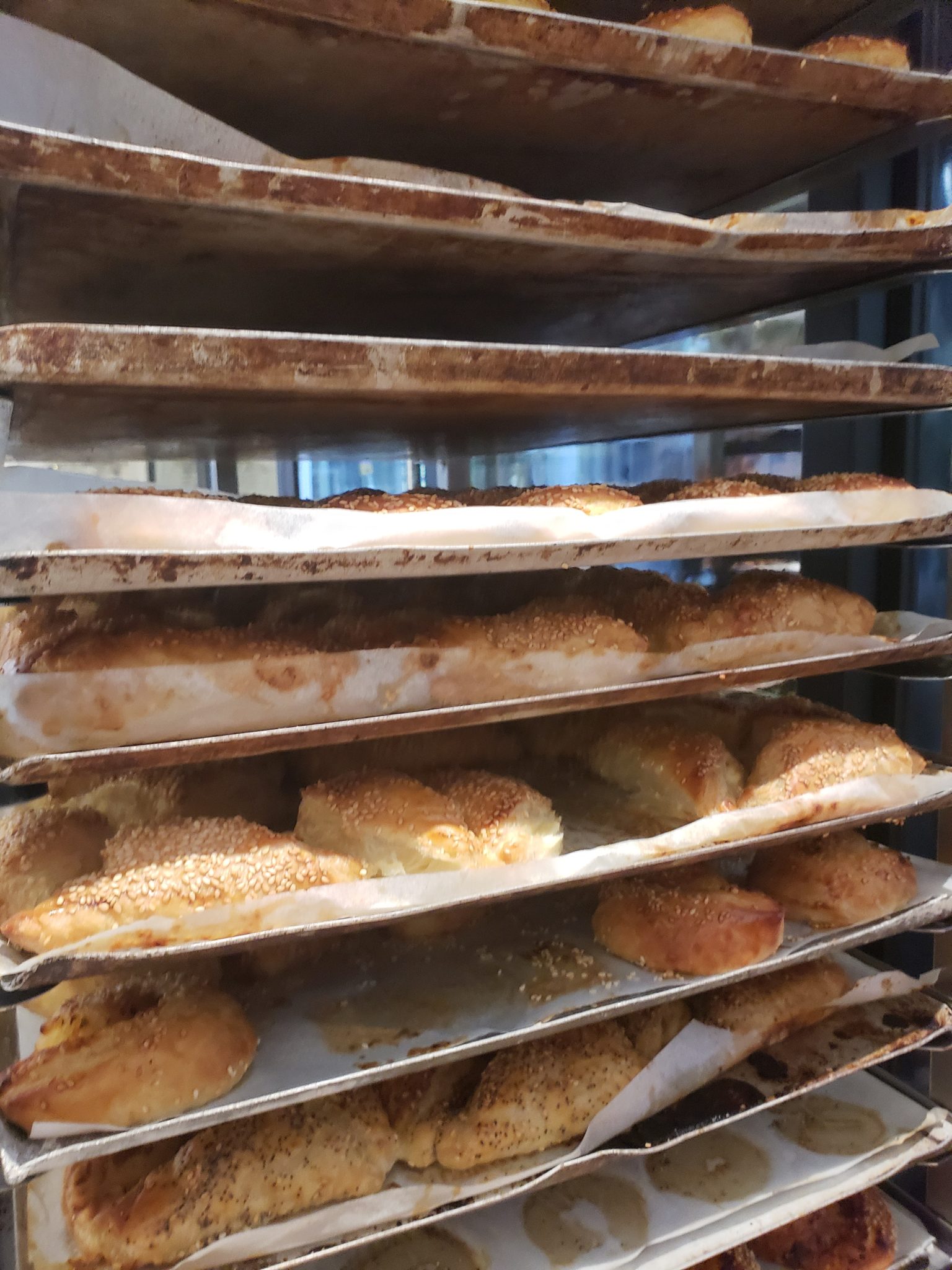 a trays of bread on a rack