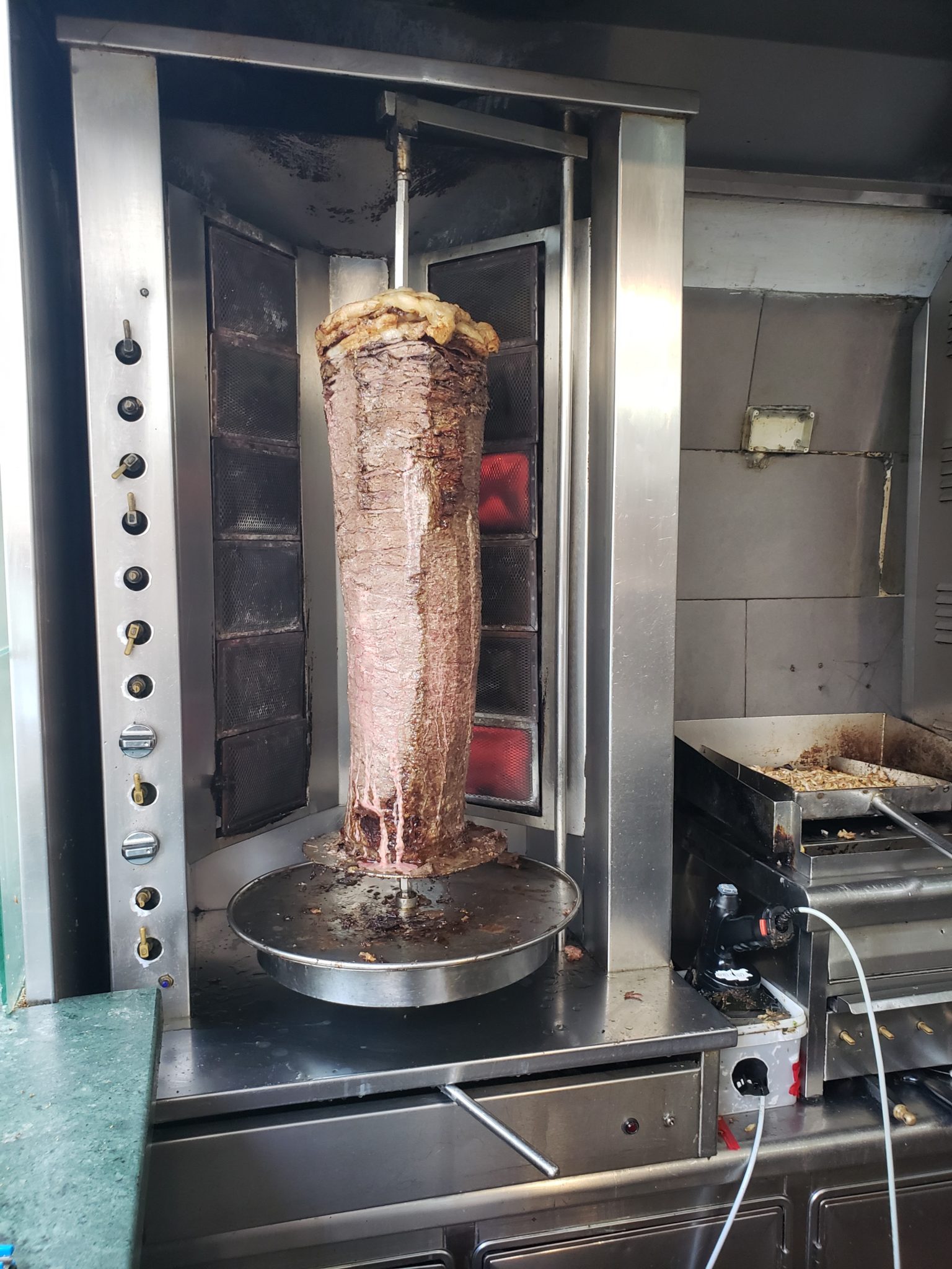 a meat on a rotating grill