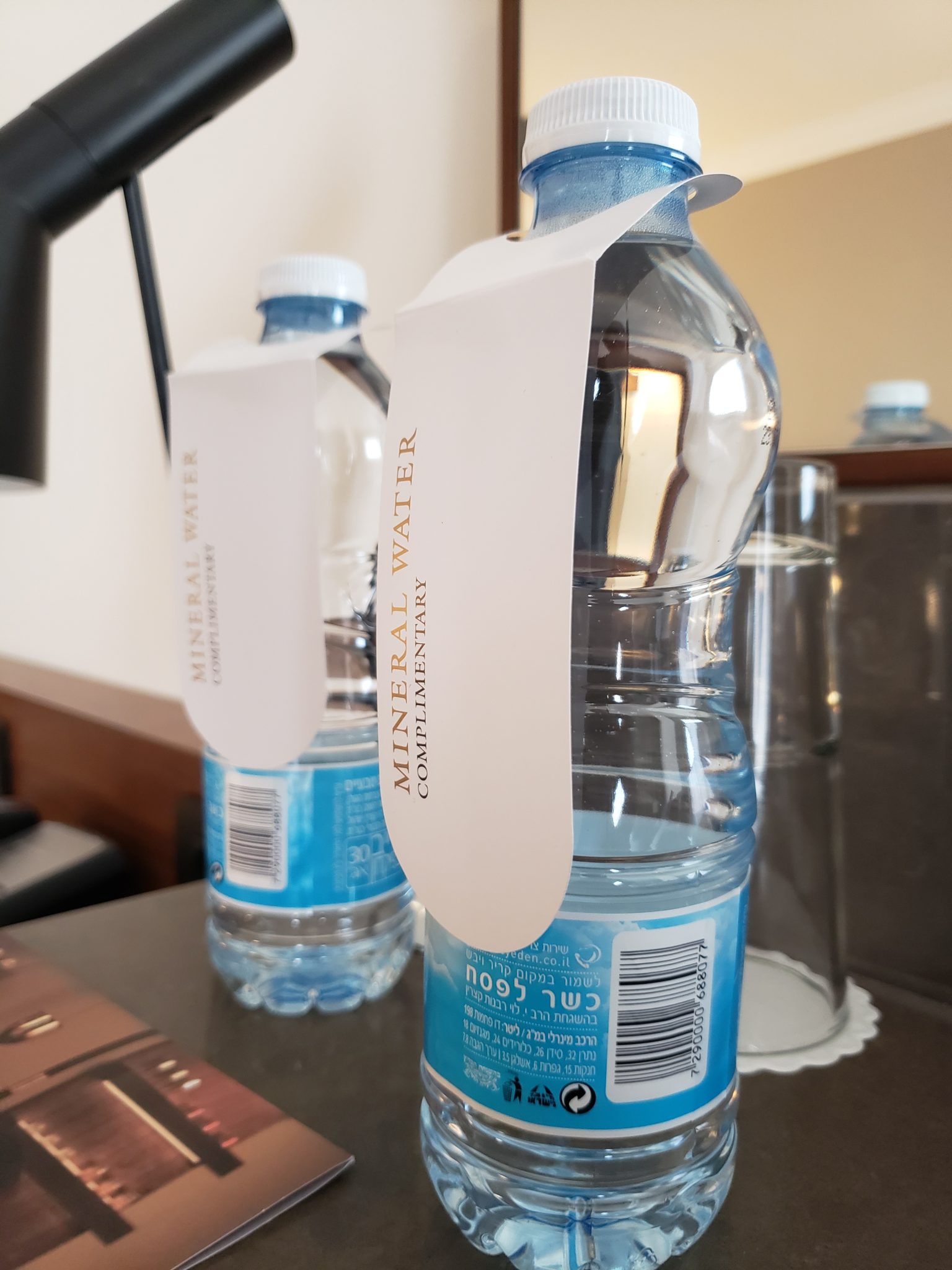 a group of water bottles with a label attached to them