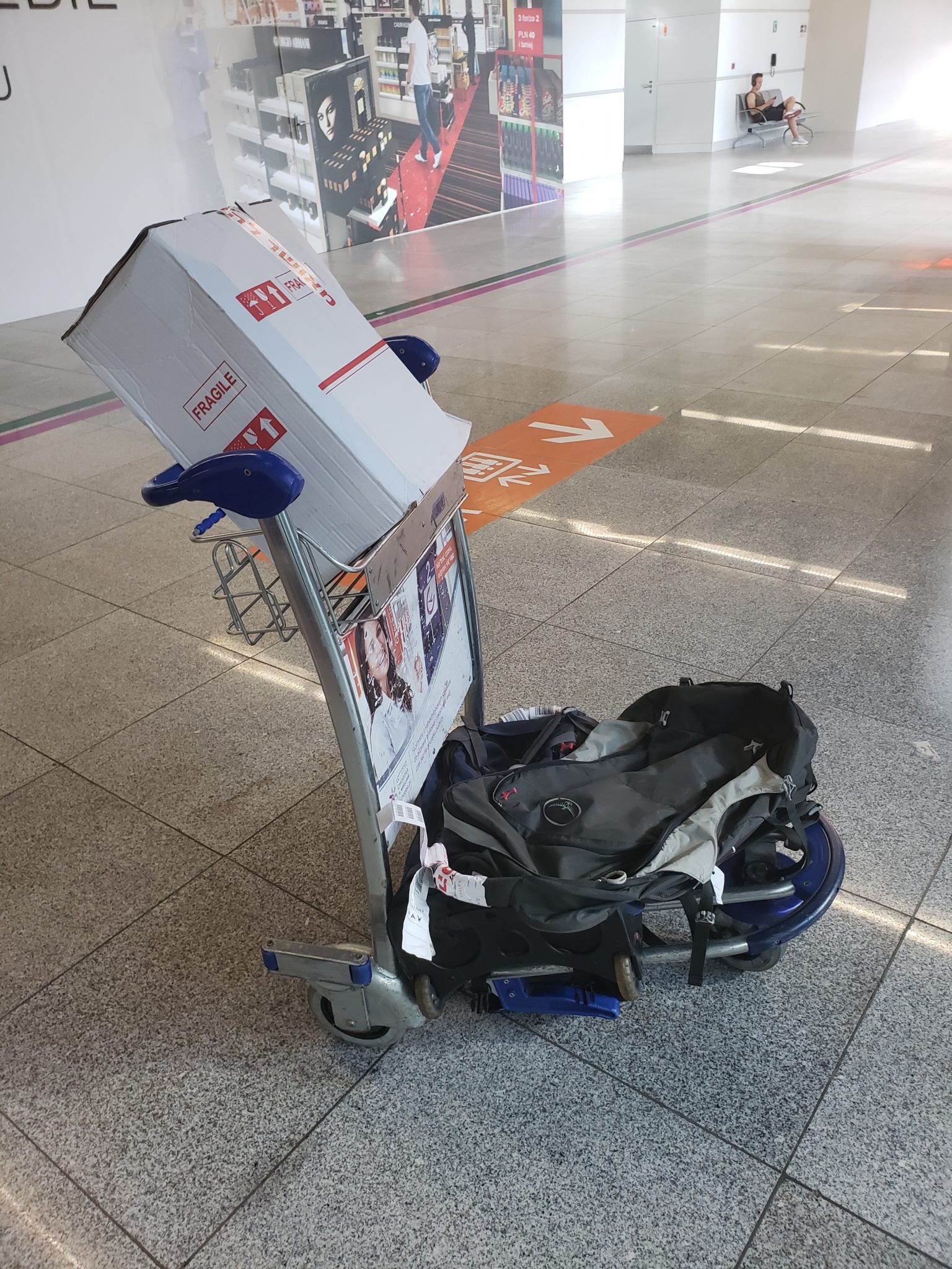 a luggage cart with a bag on it