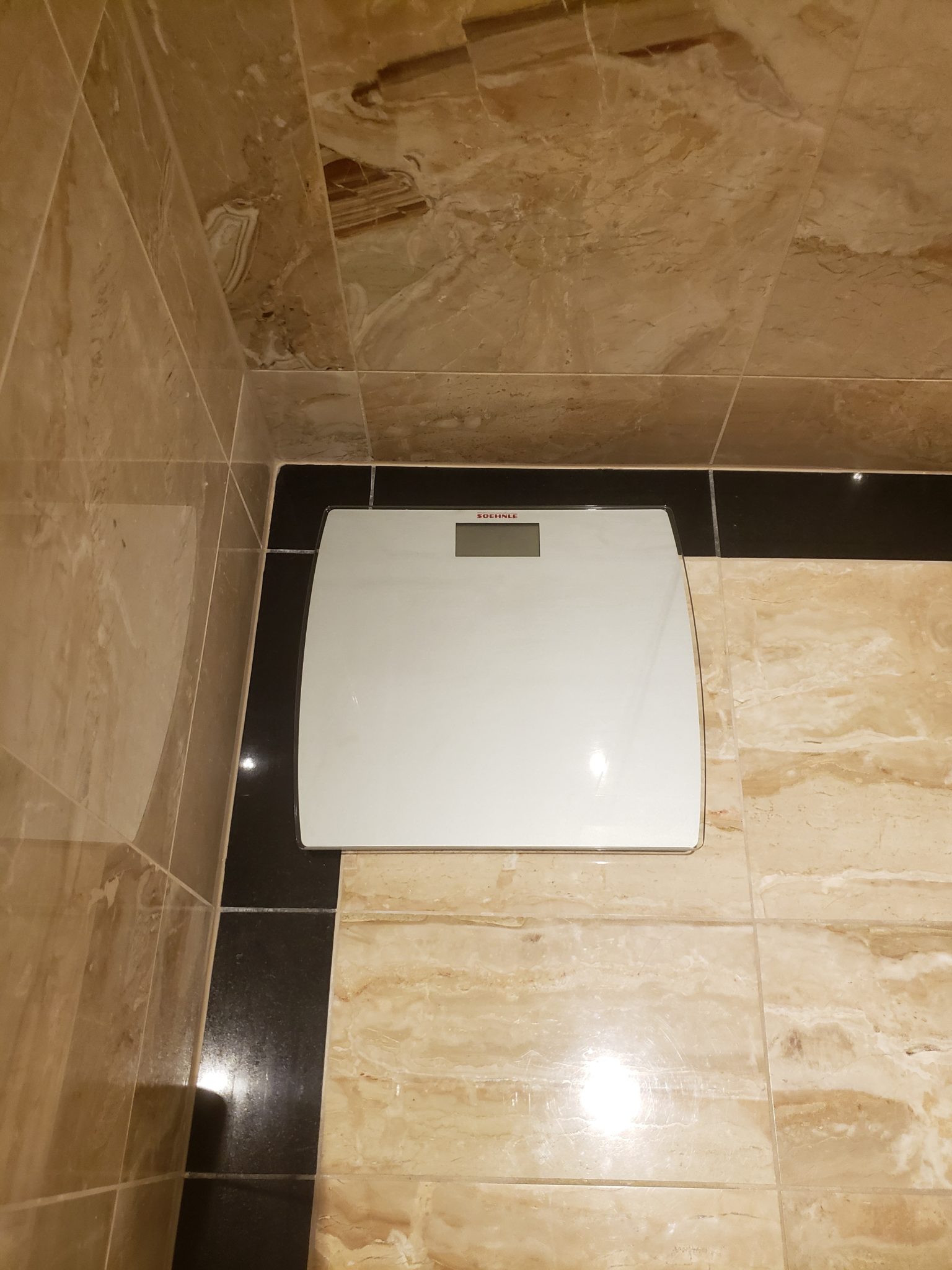 a scale on a tile floor