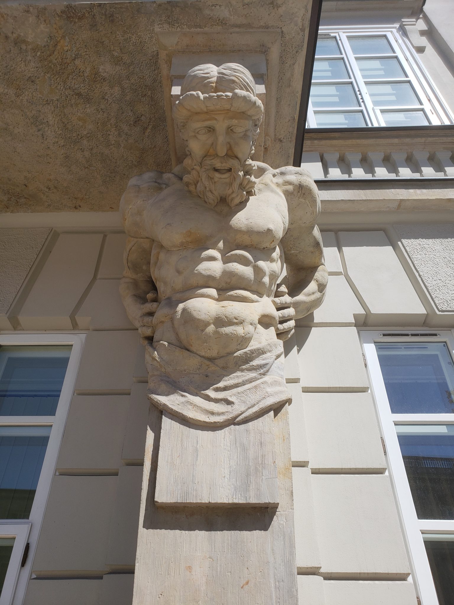a statue of a man on a building