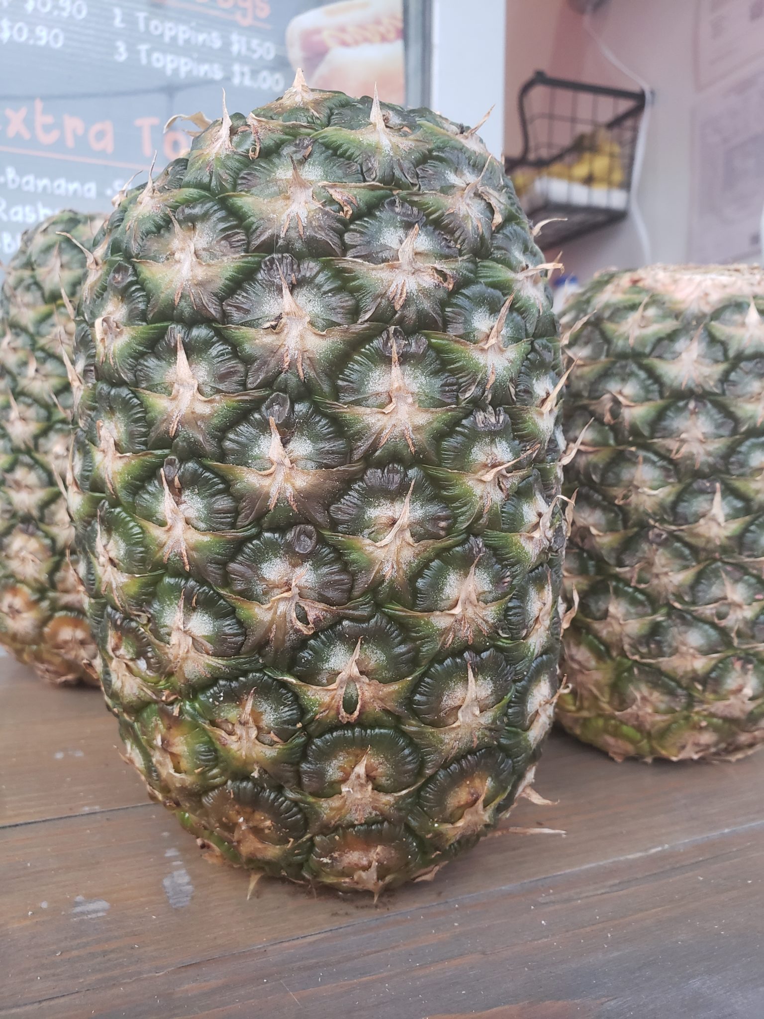 a group of pineapples on a table