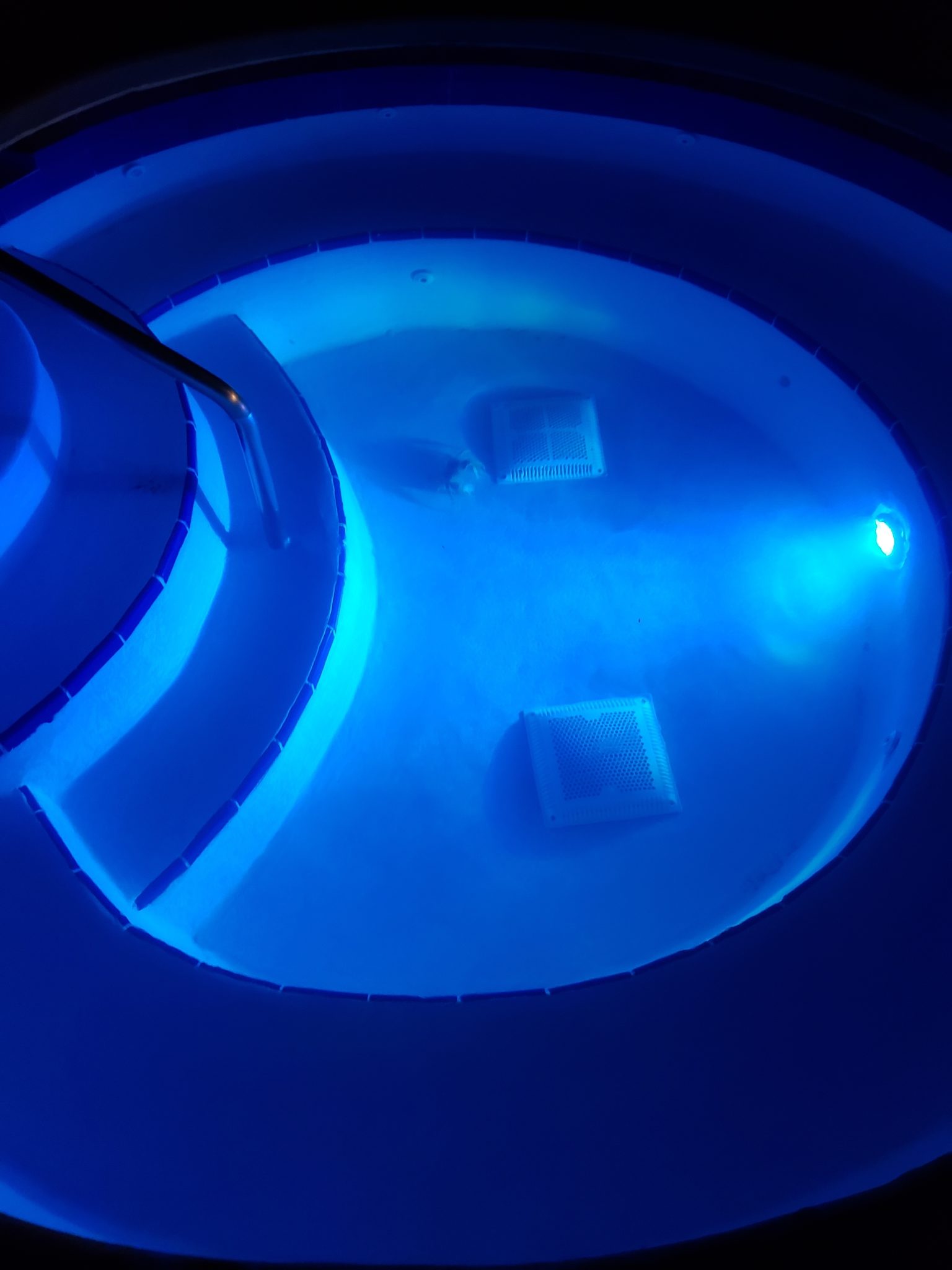 a hot tub with a blue light
