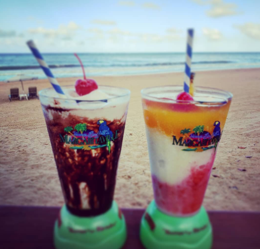 two drinks on a beach