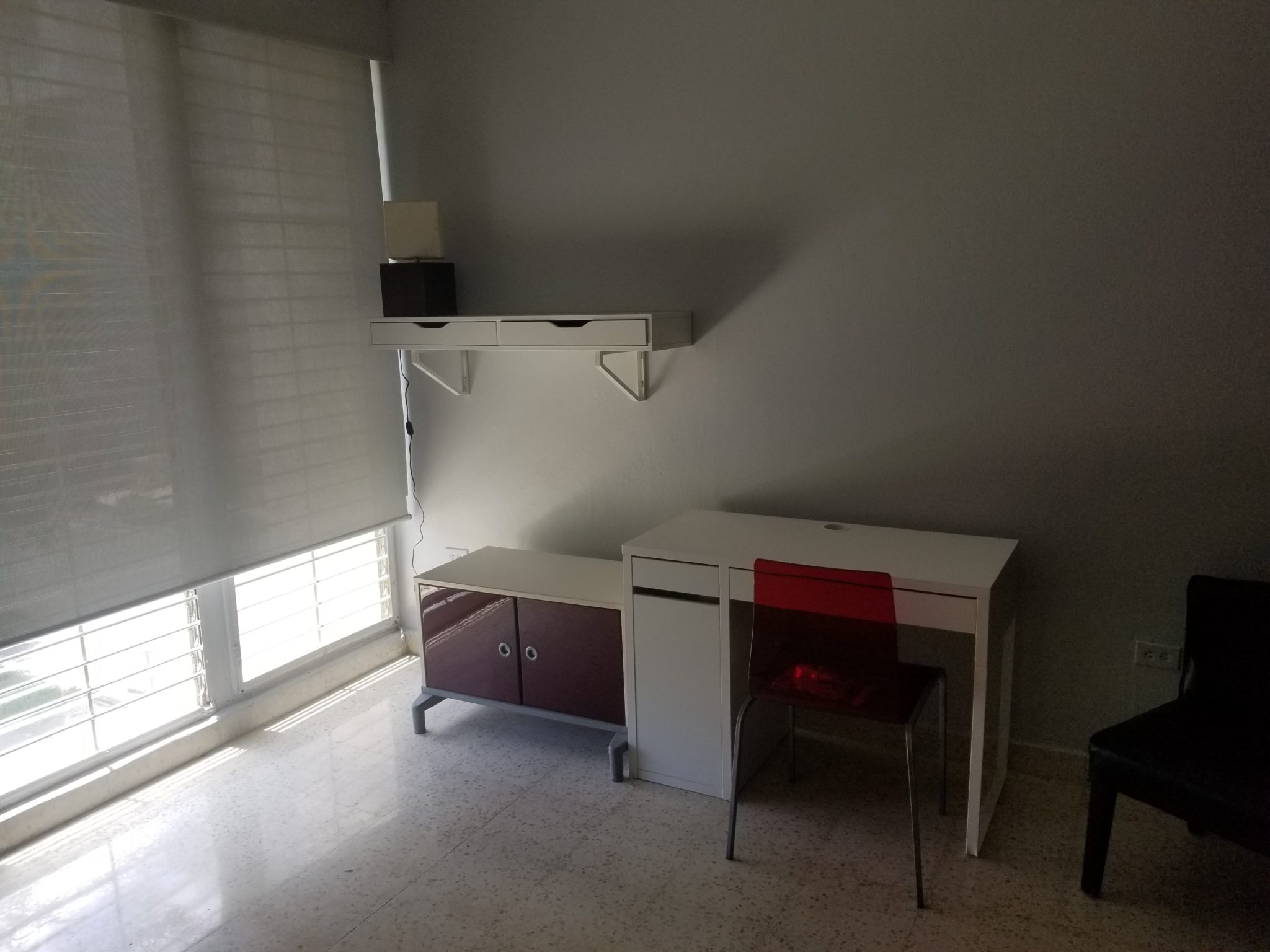 a desk and chair in a room