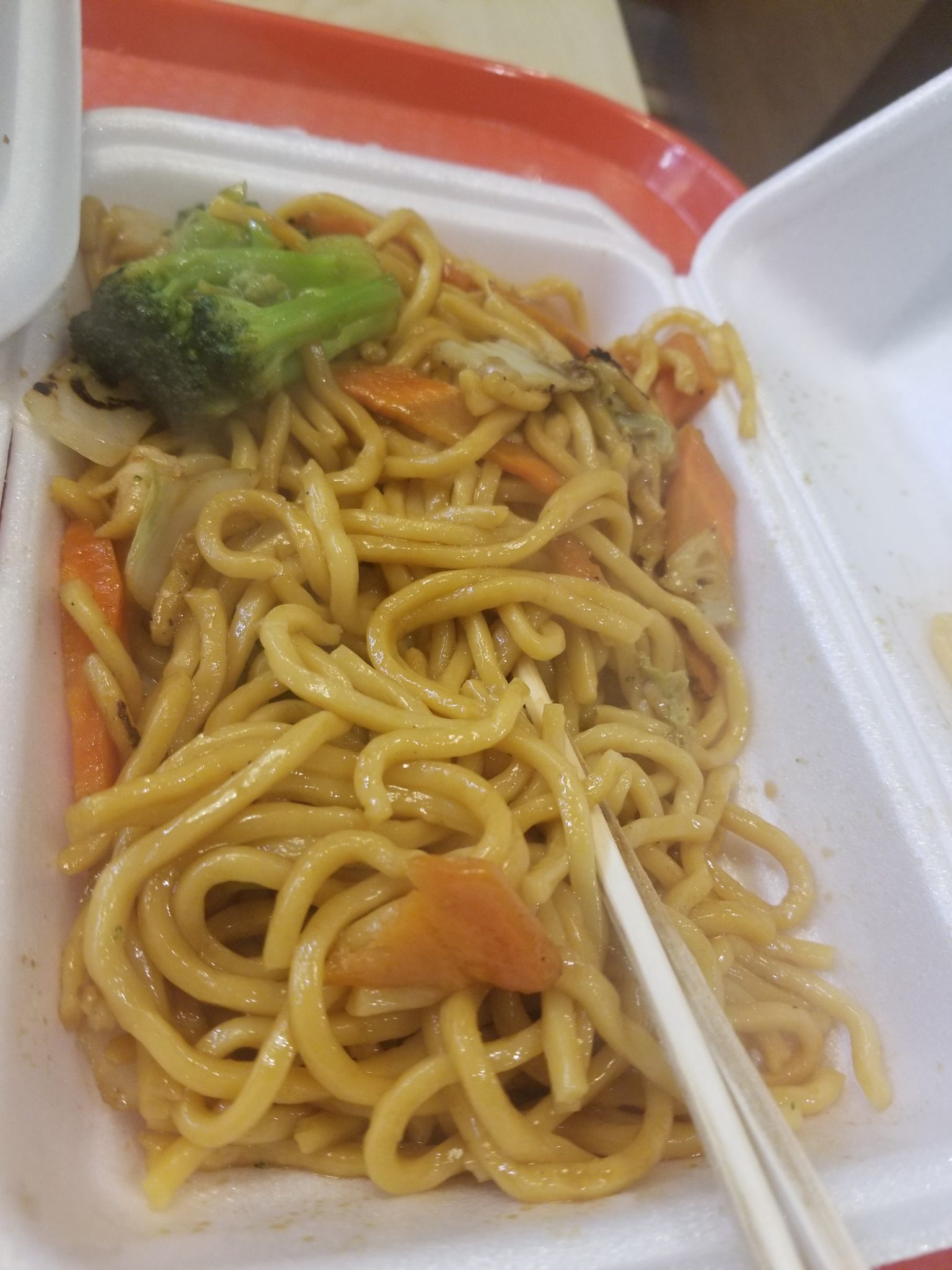 a box of noodles and vegetables