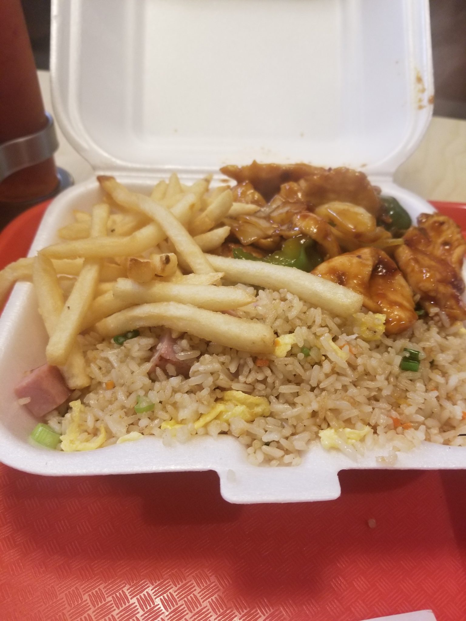 a styrofoam container with a meal