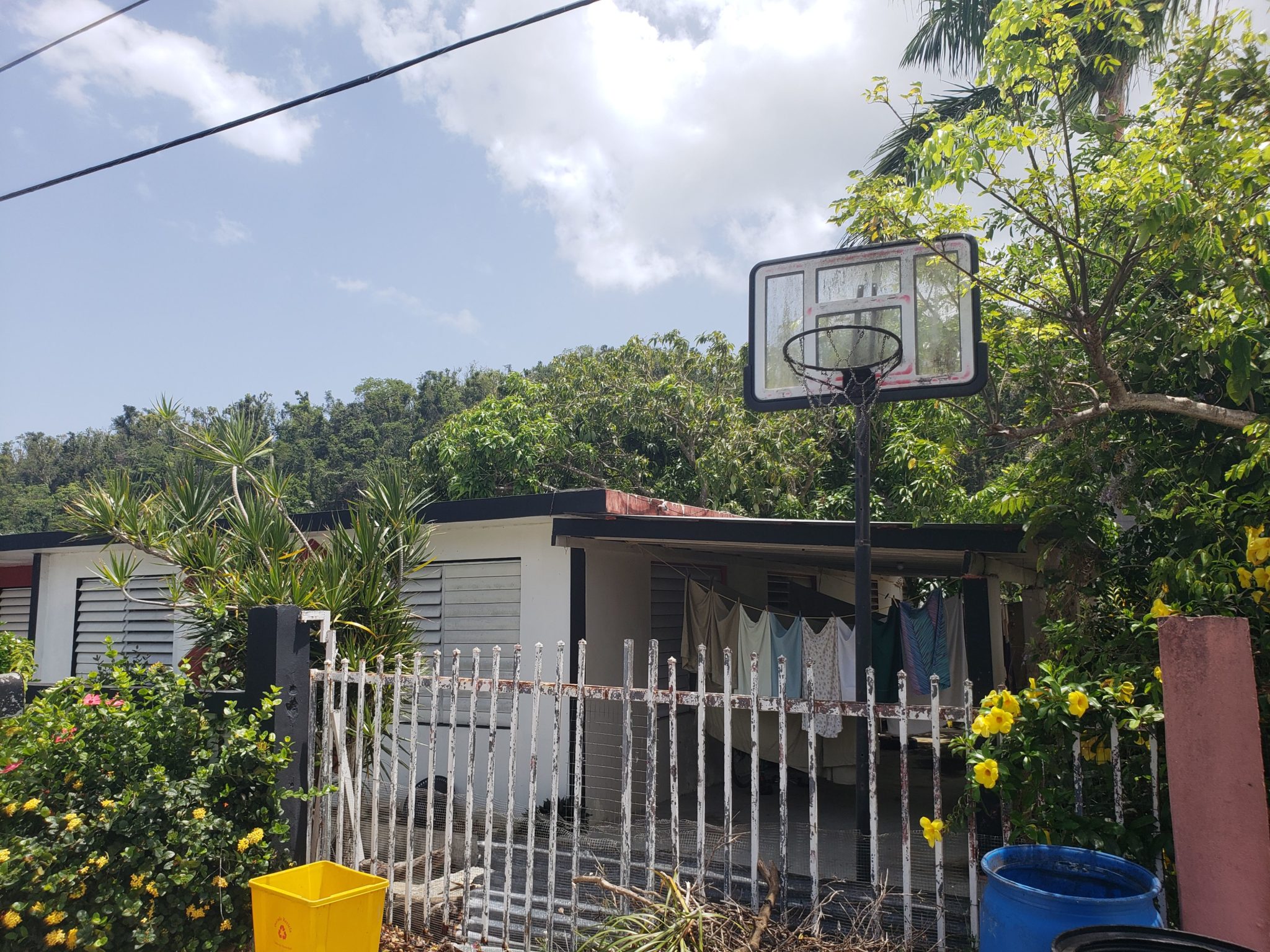 a basketball hoop in front of a house