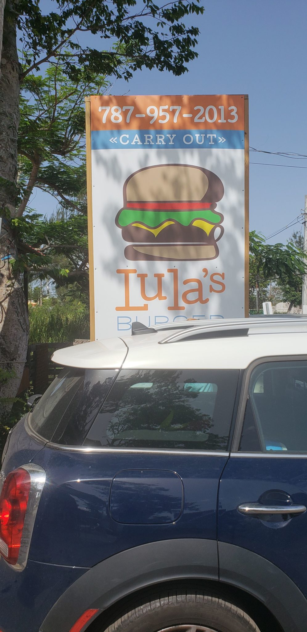 a sign with a burger on it