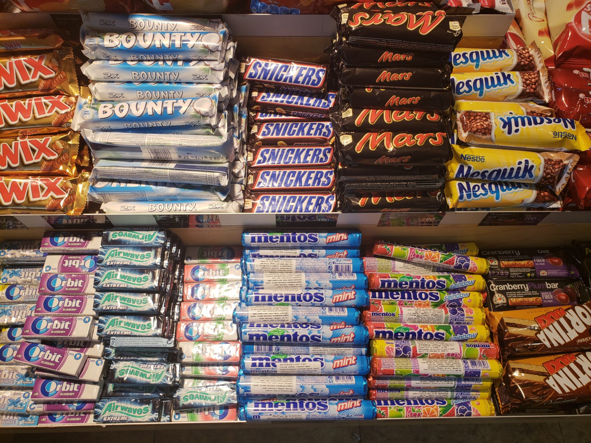 a shelf of candy bars