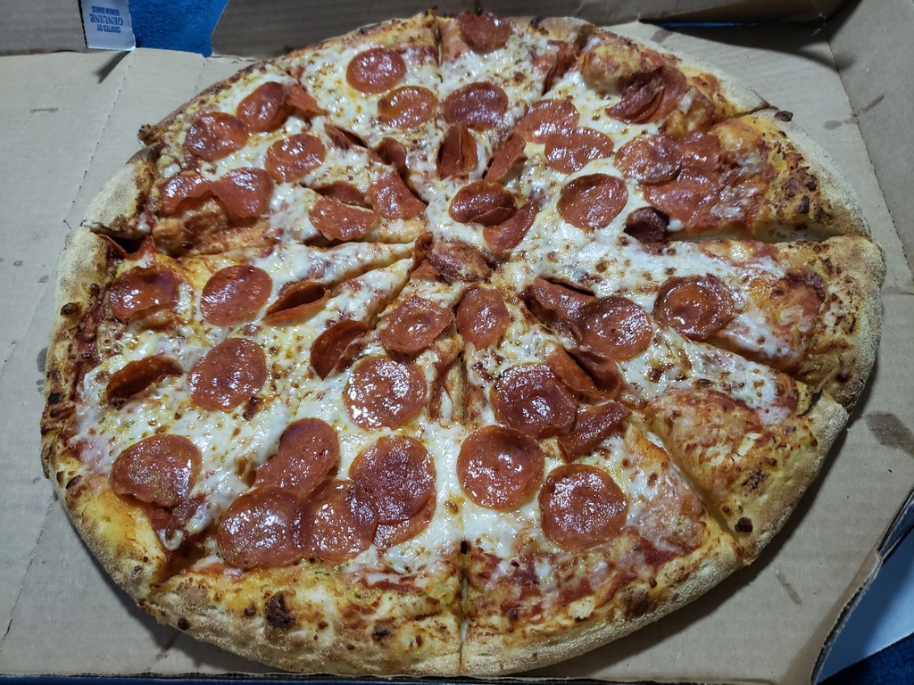 a pepperoni pizza in a box