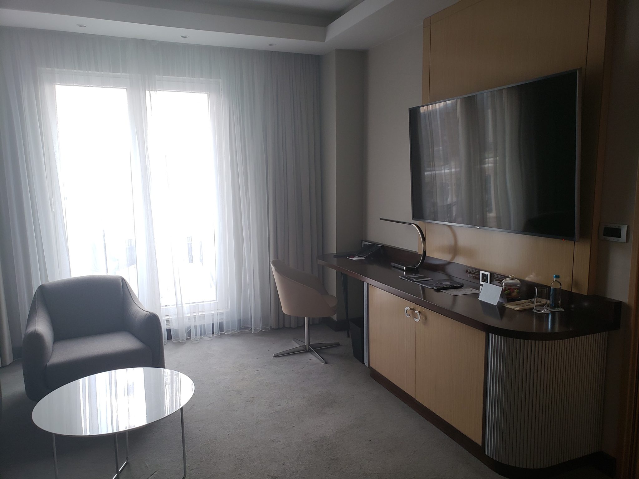 a room with a tv and a chair
