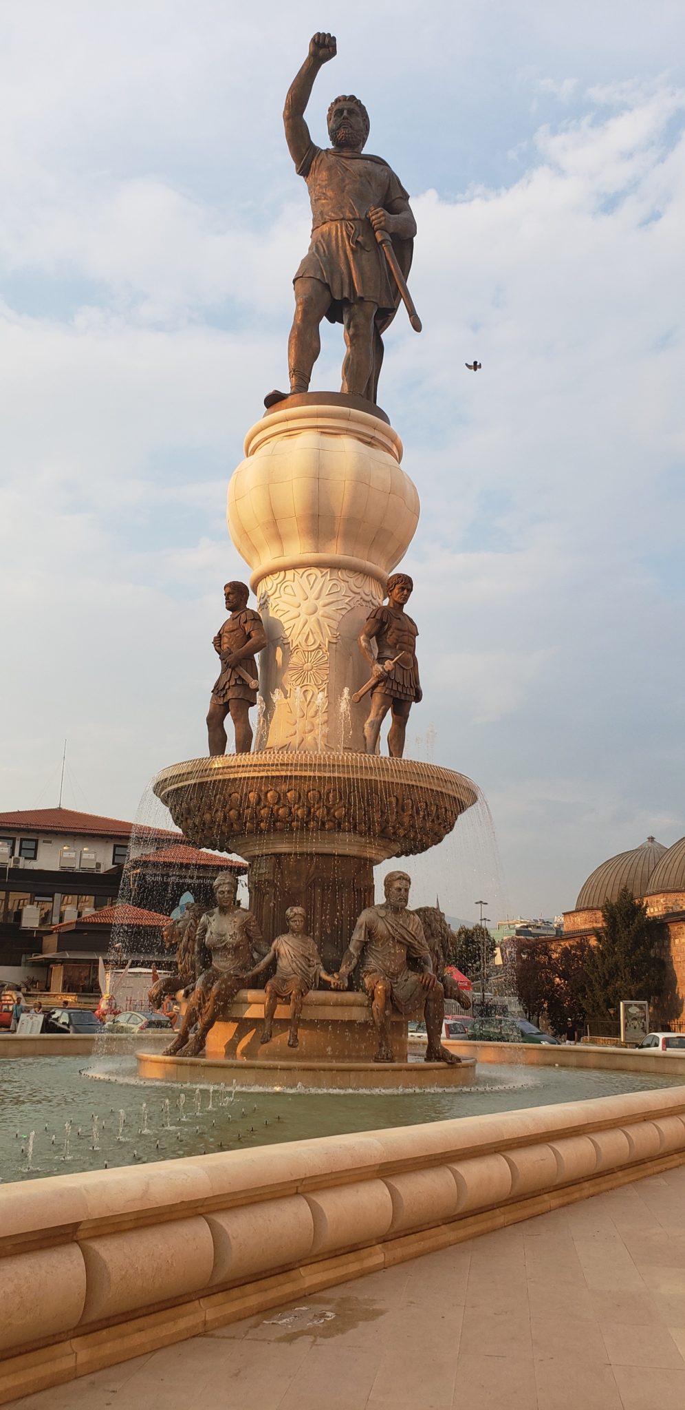 a statue of a man on top of a fountain