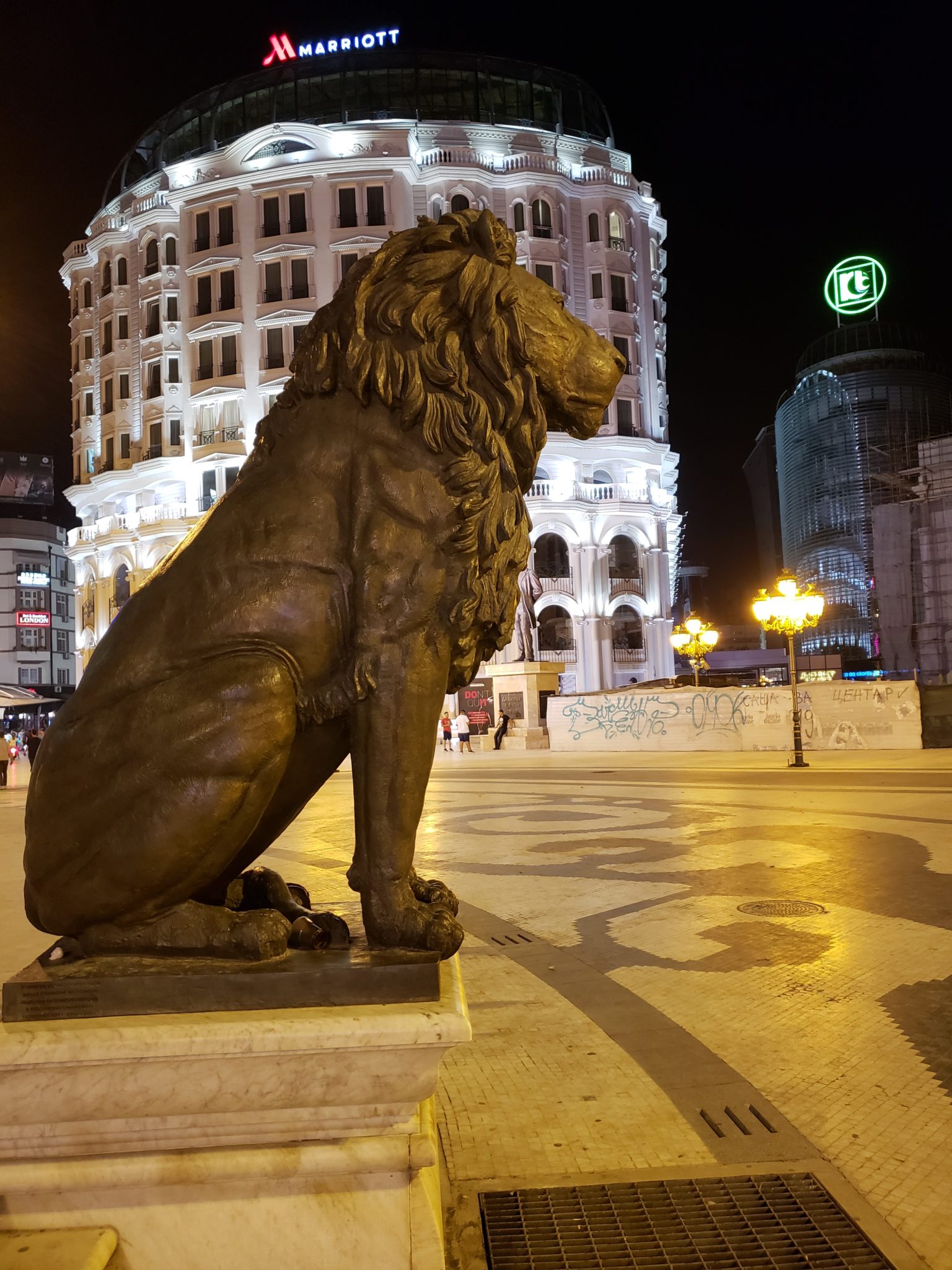 a statue of a lion in a city