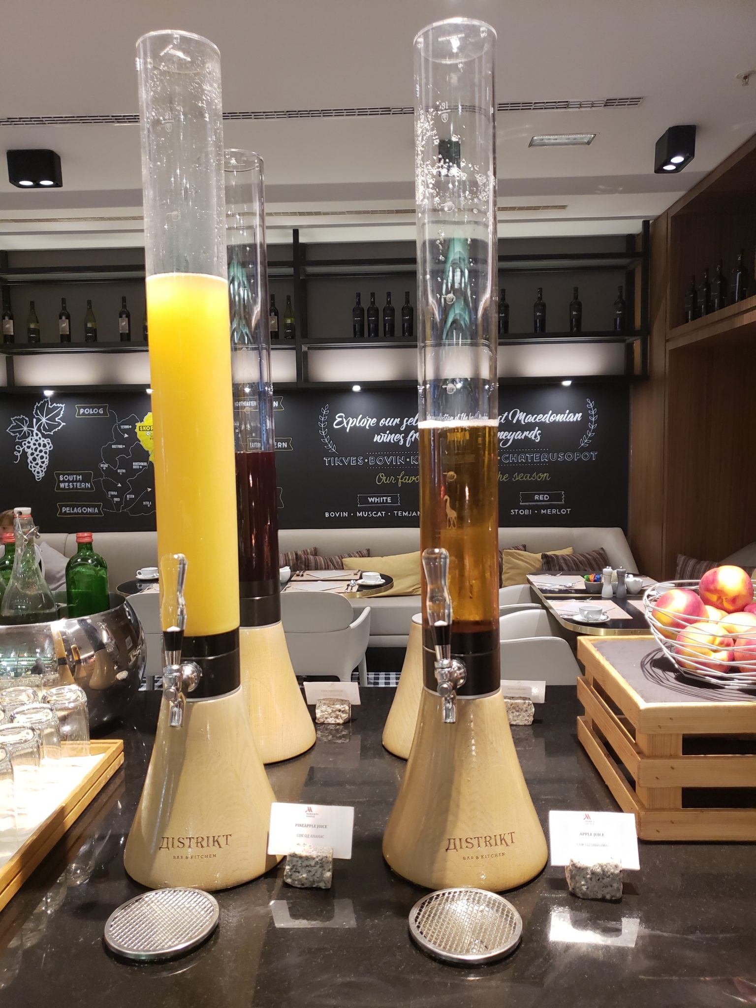 a group of tall glass containers with liquid in them