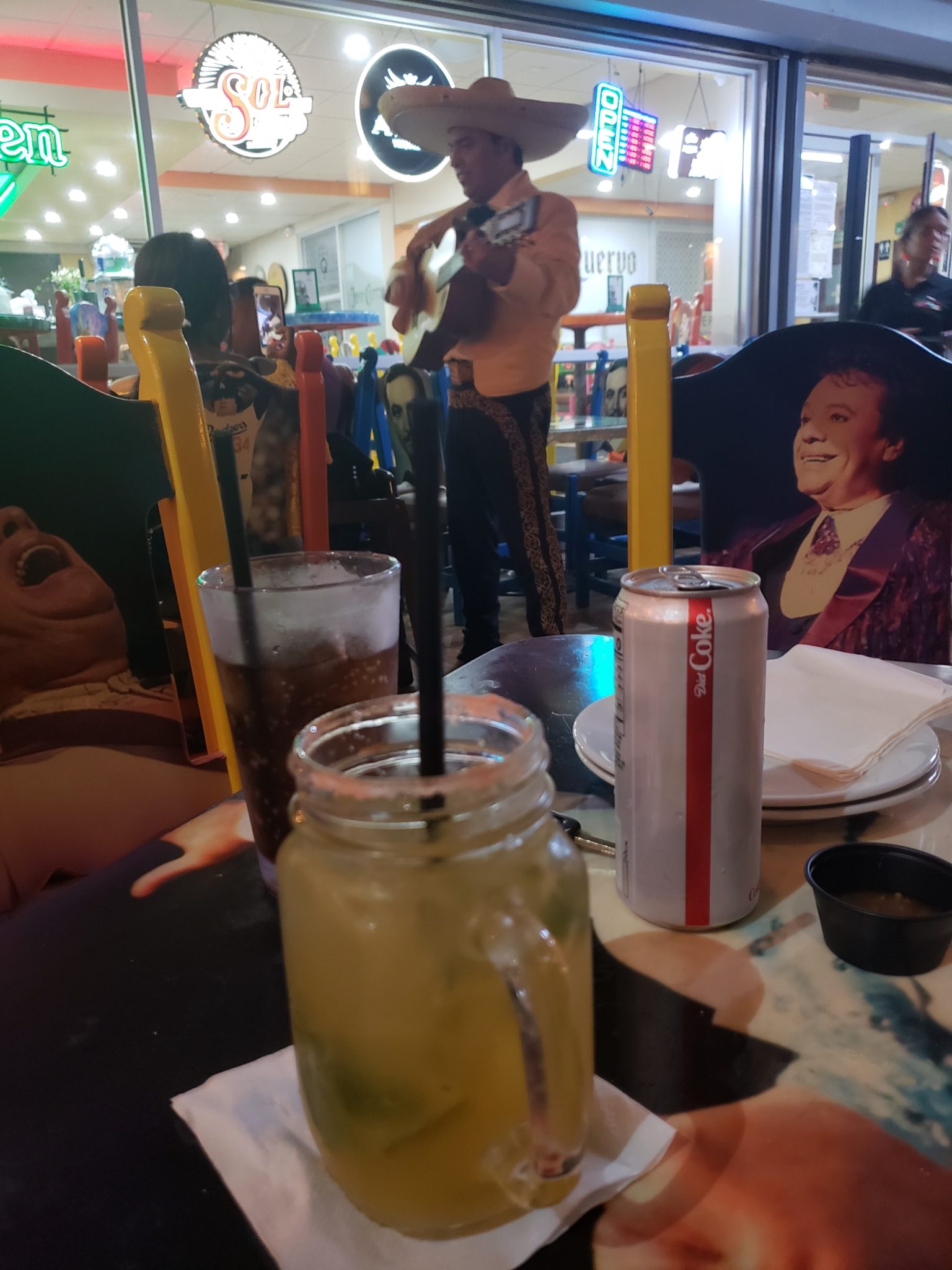 a man playing guitar at a restaurant