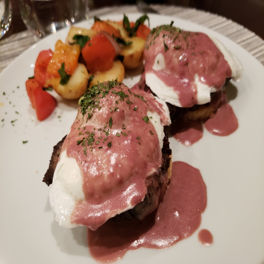 a plate of food with a pink sauce on it