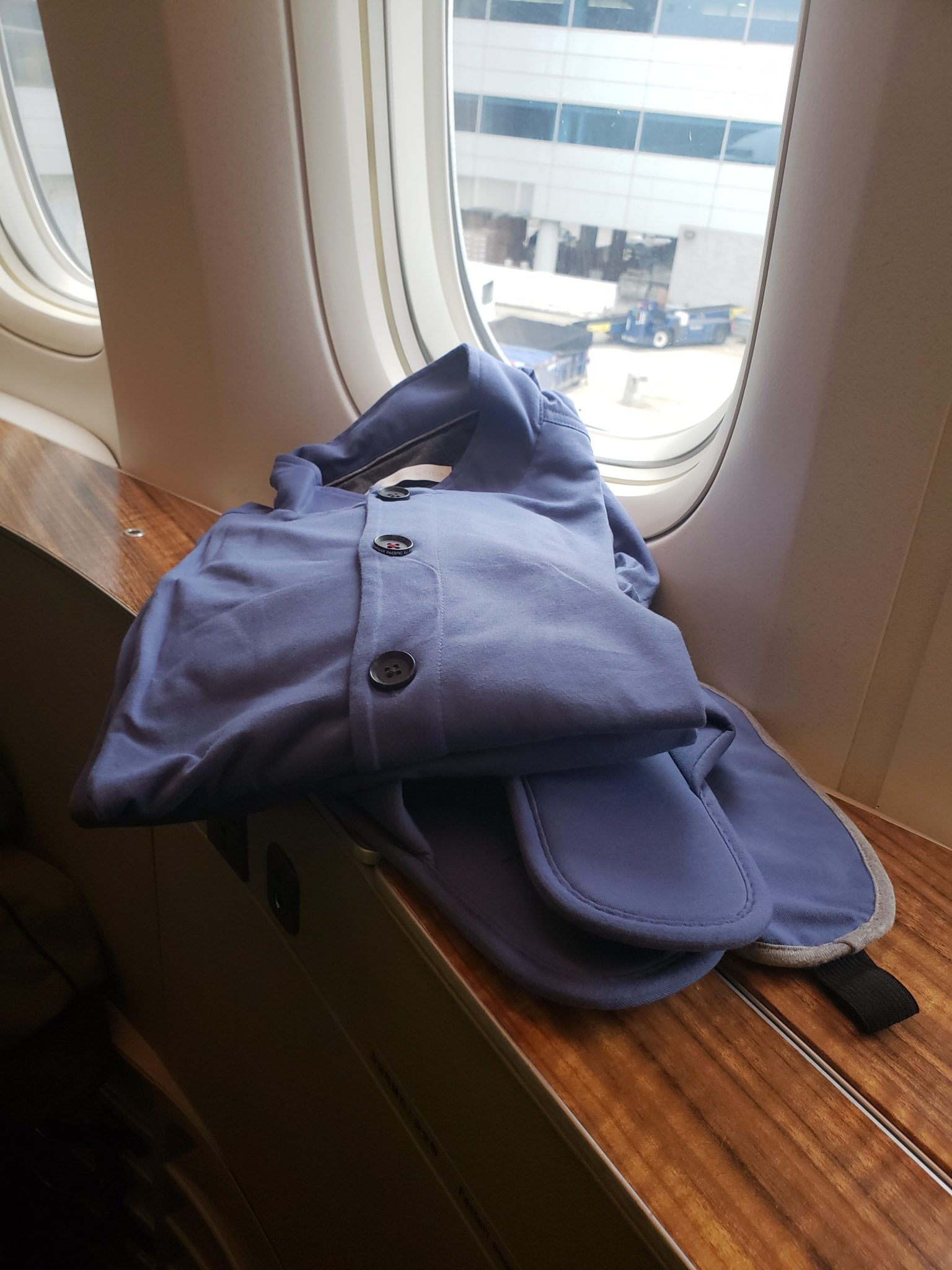 a blue shirt on a window sill