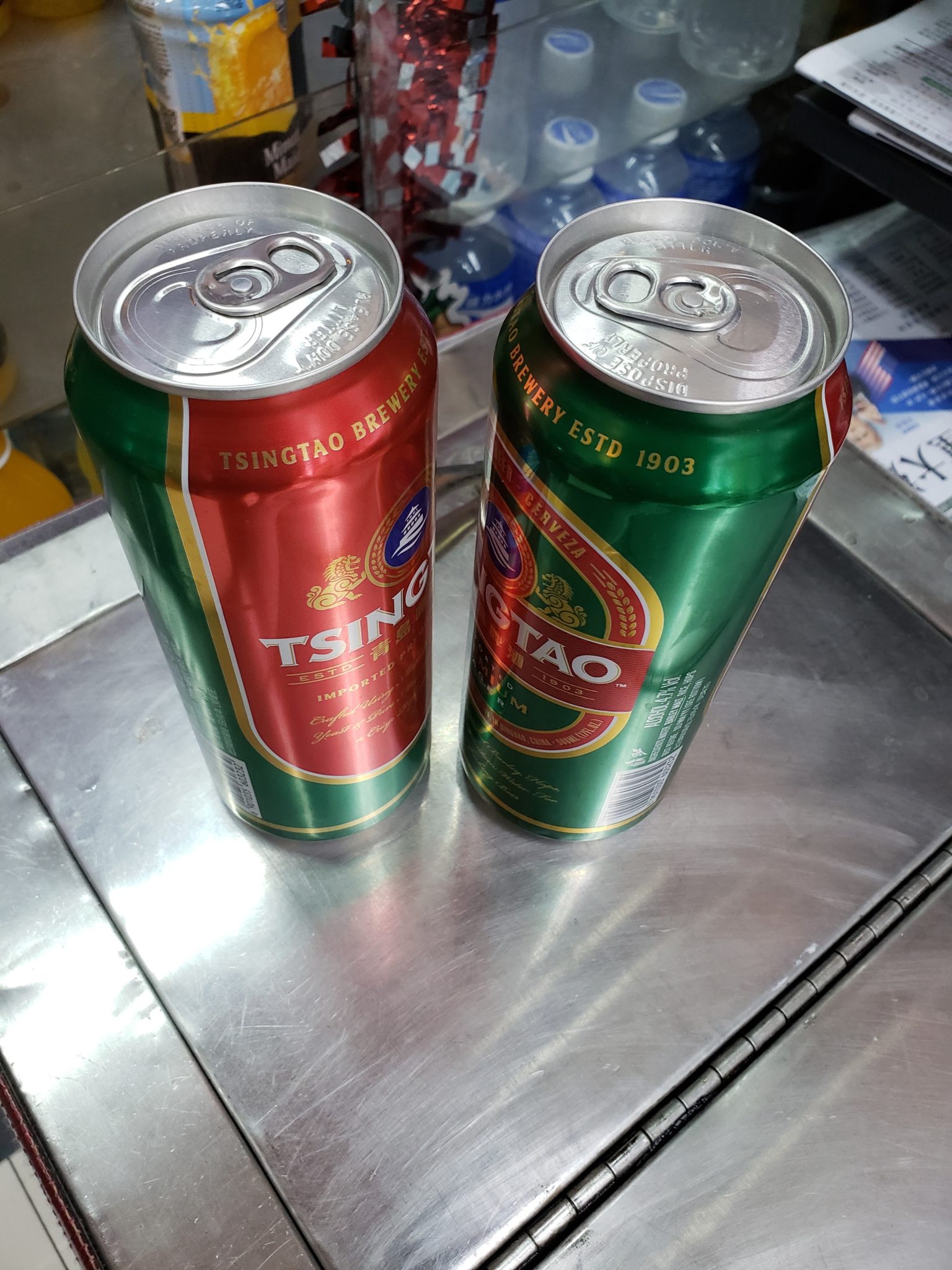two cans of beer on a table
