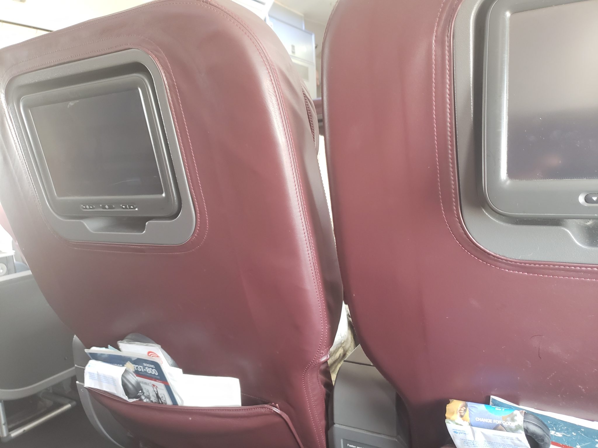a pair of seats with a pocket in the back