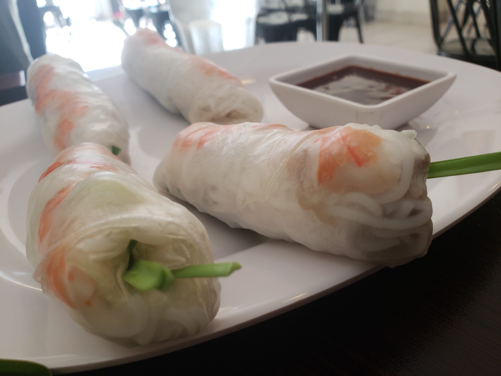 a plate of rice paper rolls