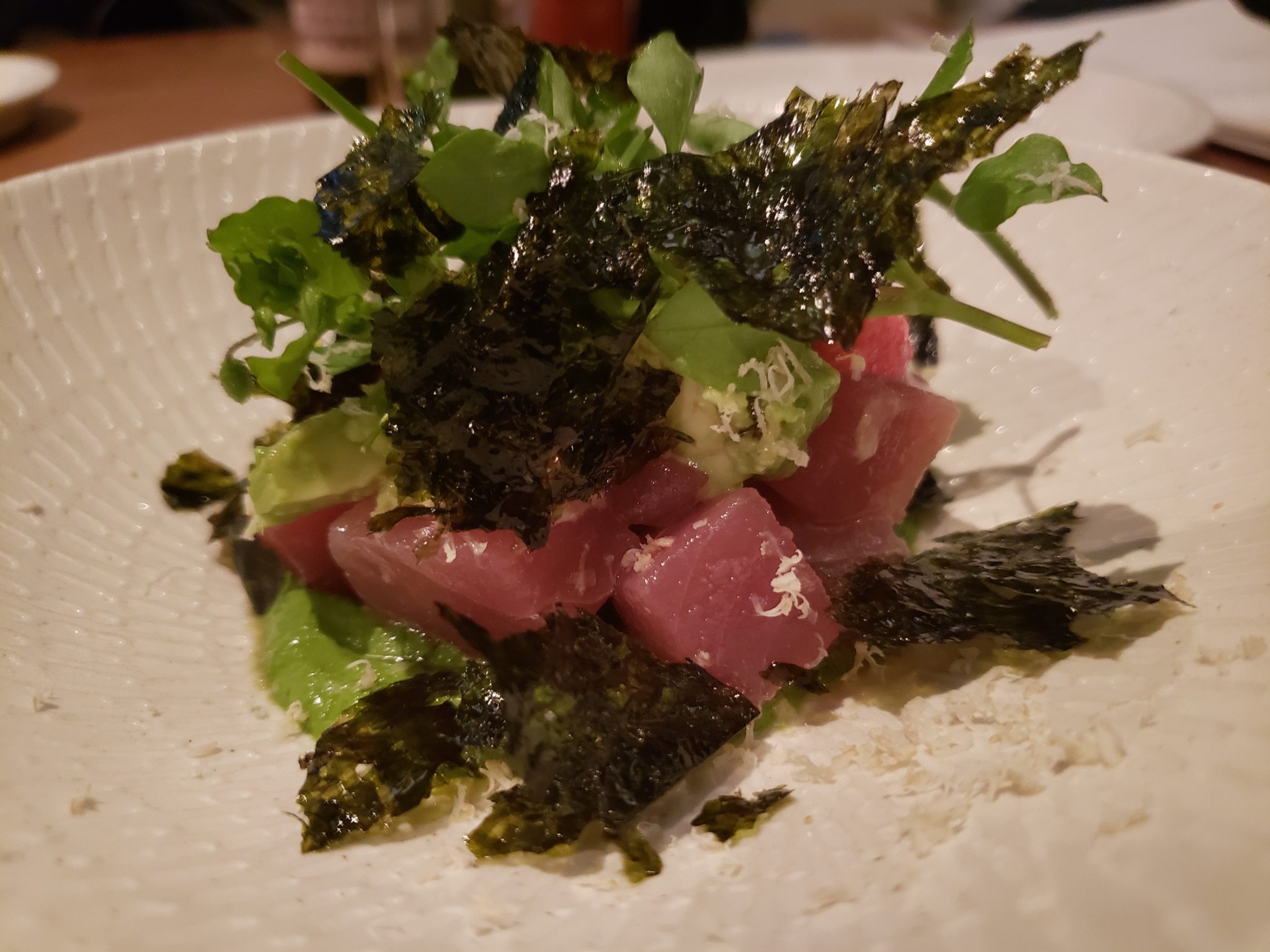 a plate of food with seaweed