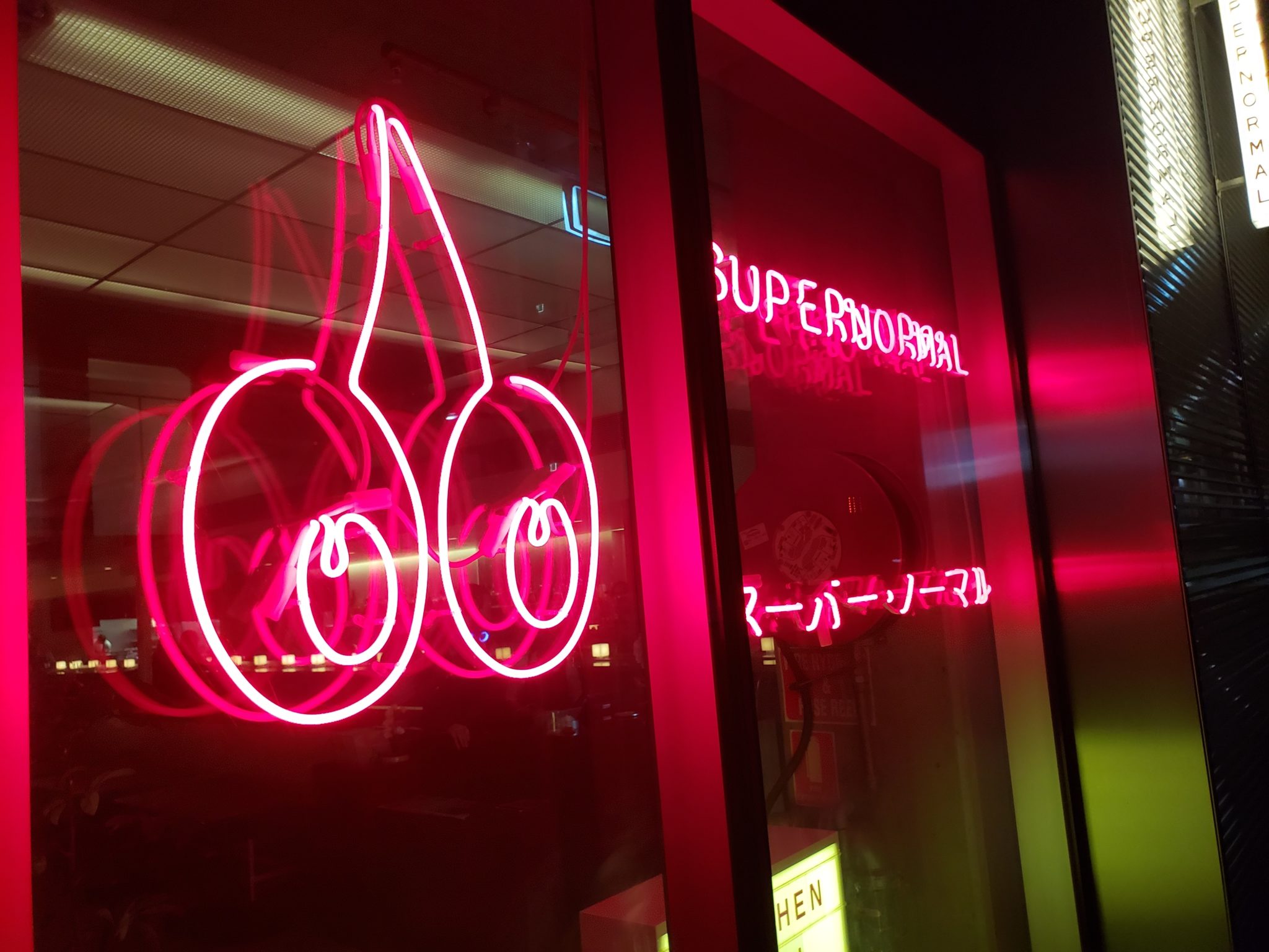 a neon sign on a window