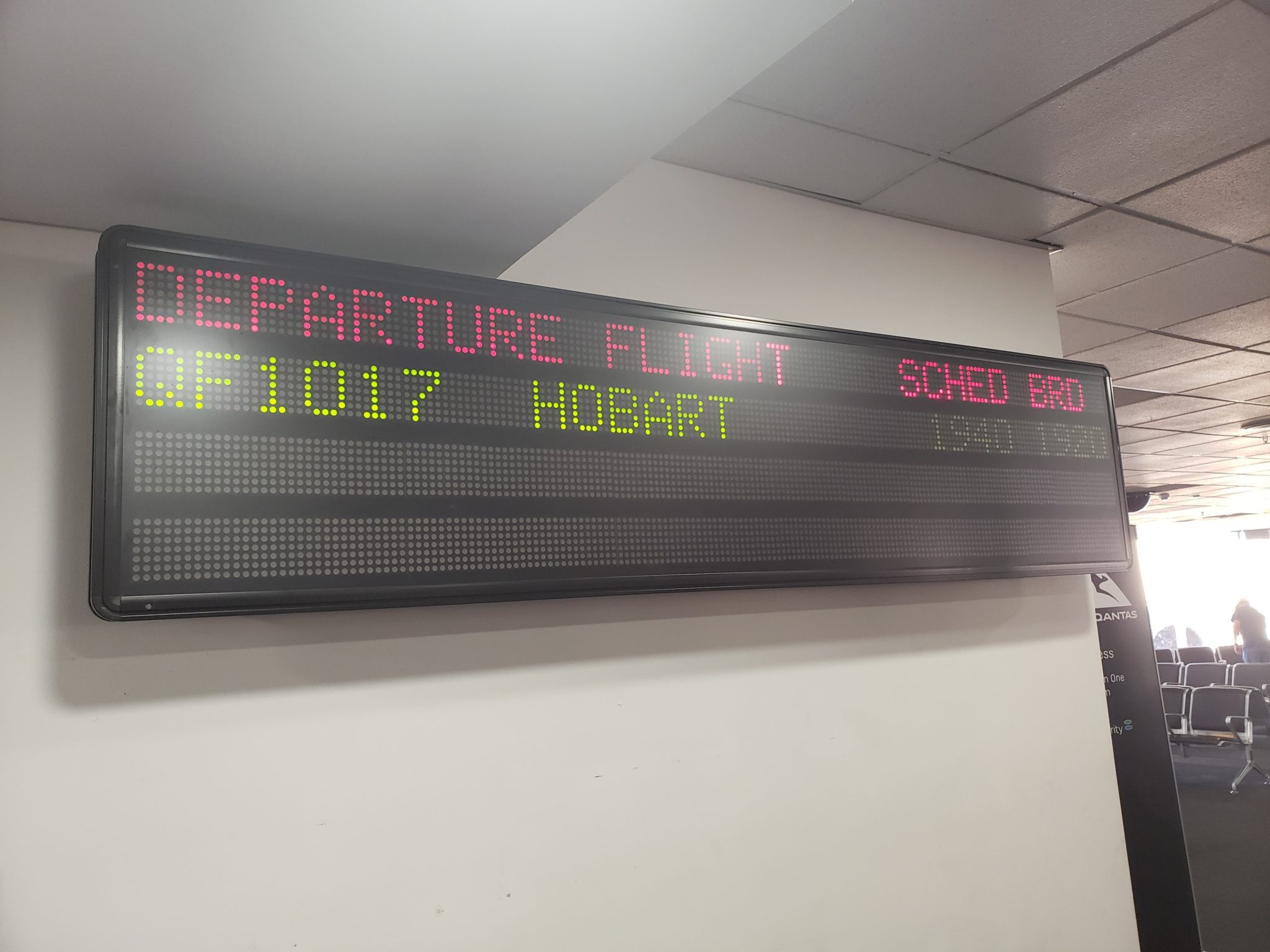 a sign with a flight schedule