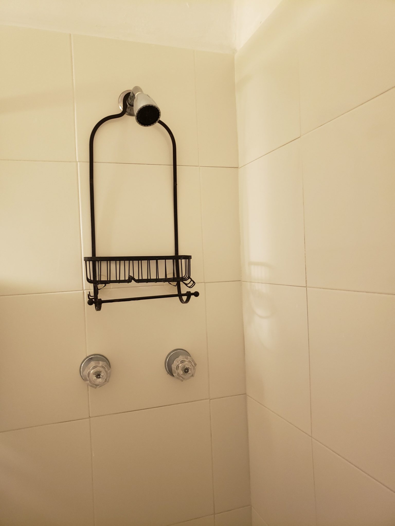a shower head and shower head on a wall