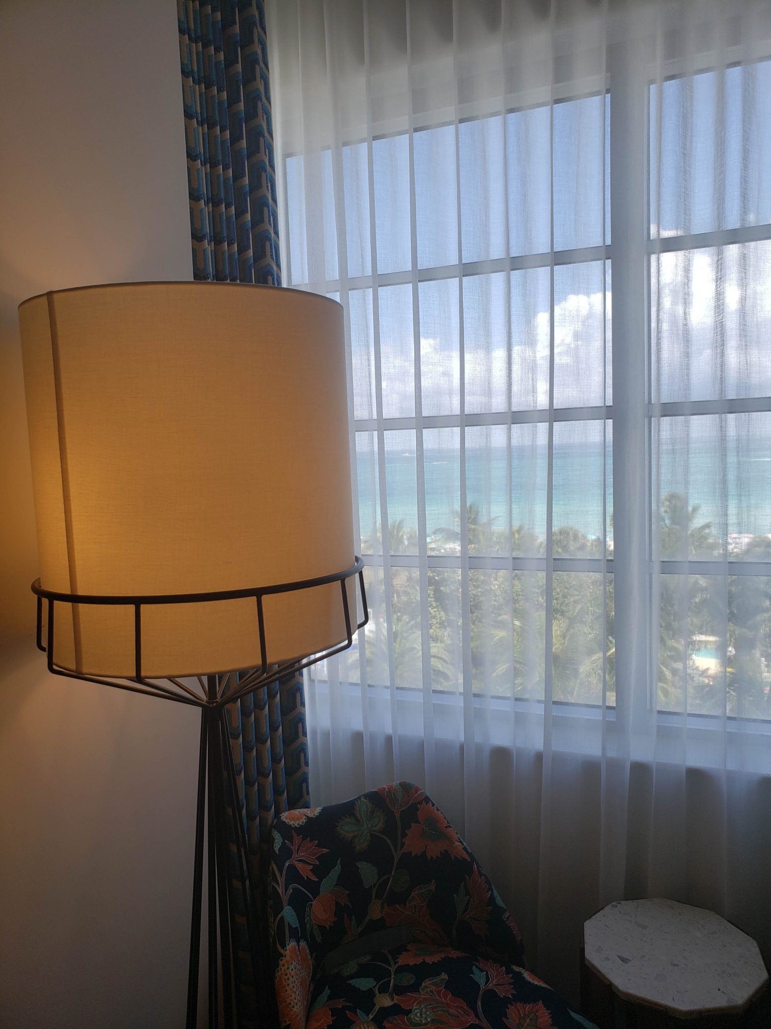 a lamp next to a window