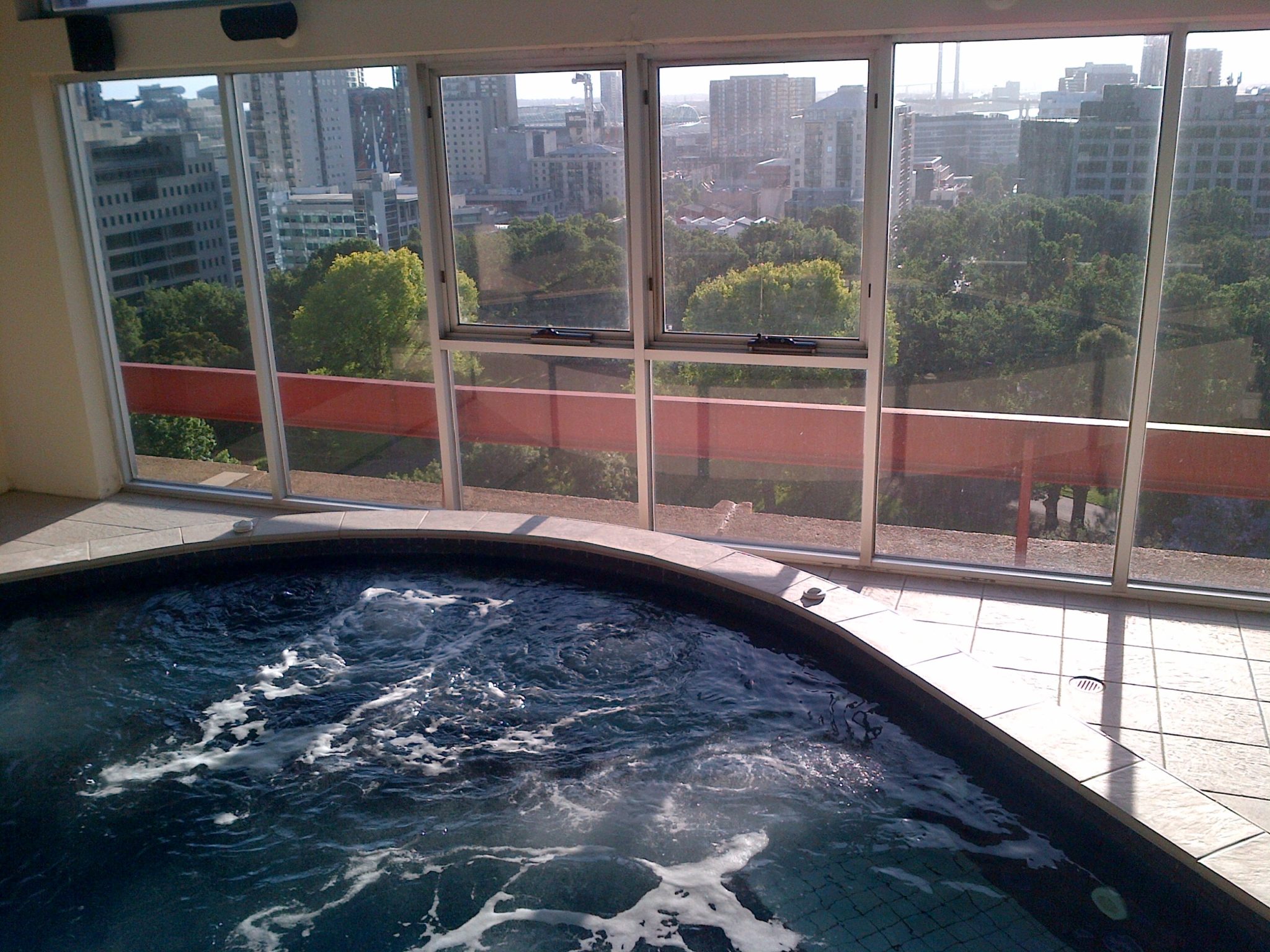 a hot tub with a view of a city