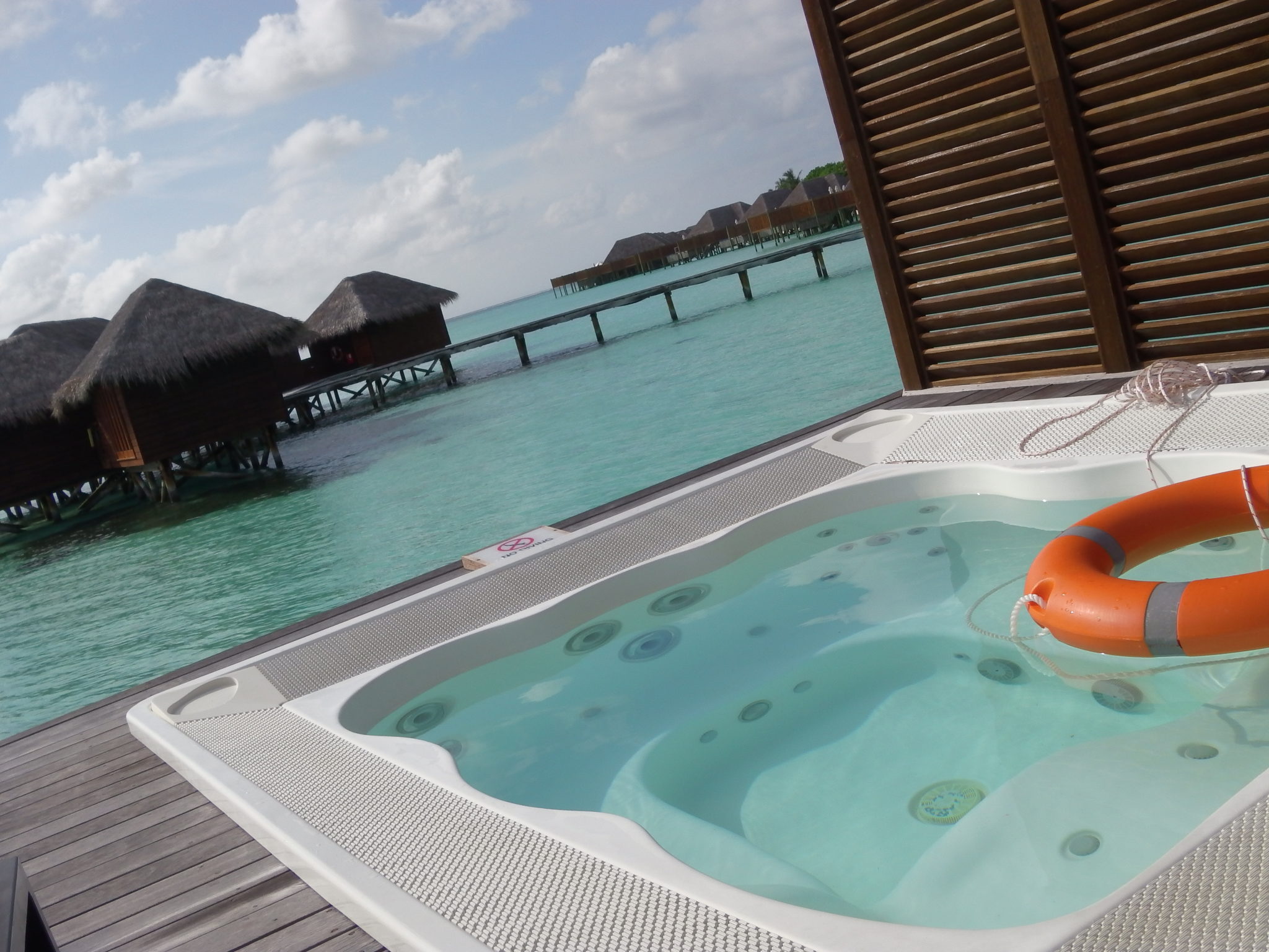 a hot tub with a floating object on the water