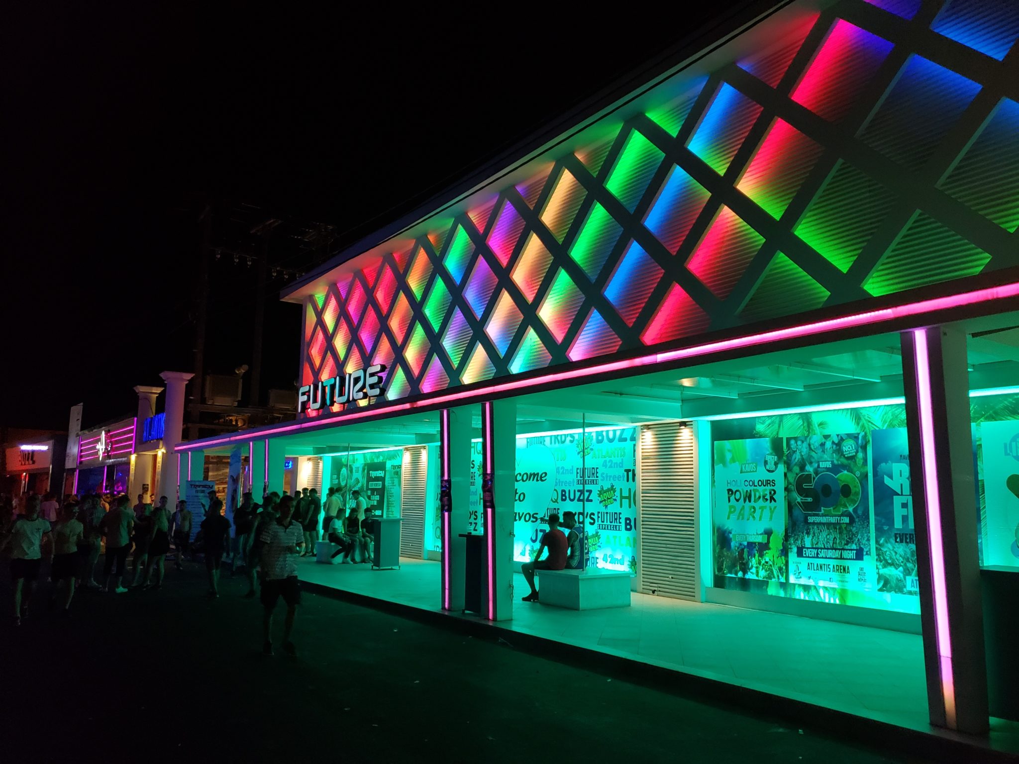 a building with colorful lights at night