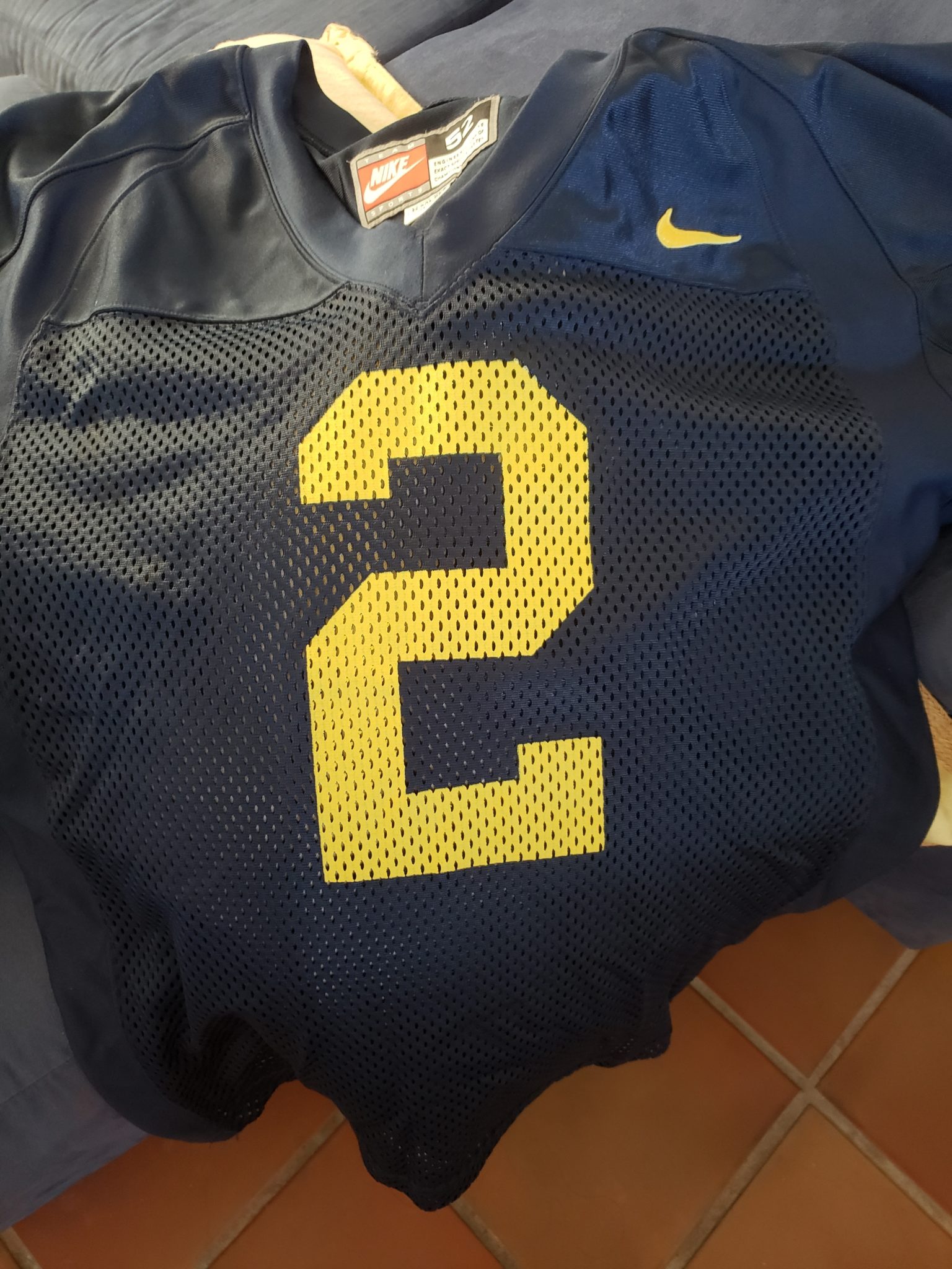 a blue football jersey with a number on it