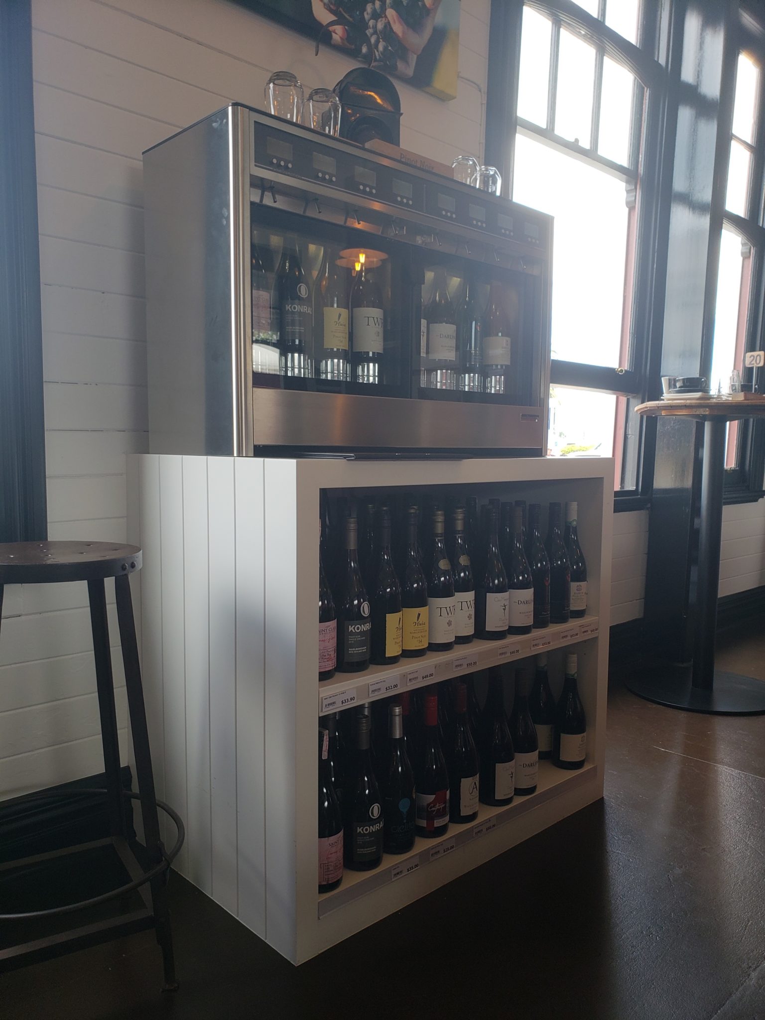 a shelf with bottles of wine on it