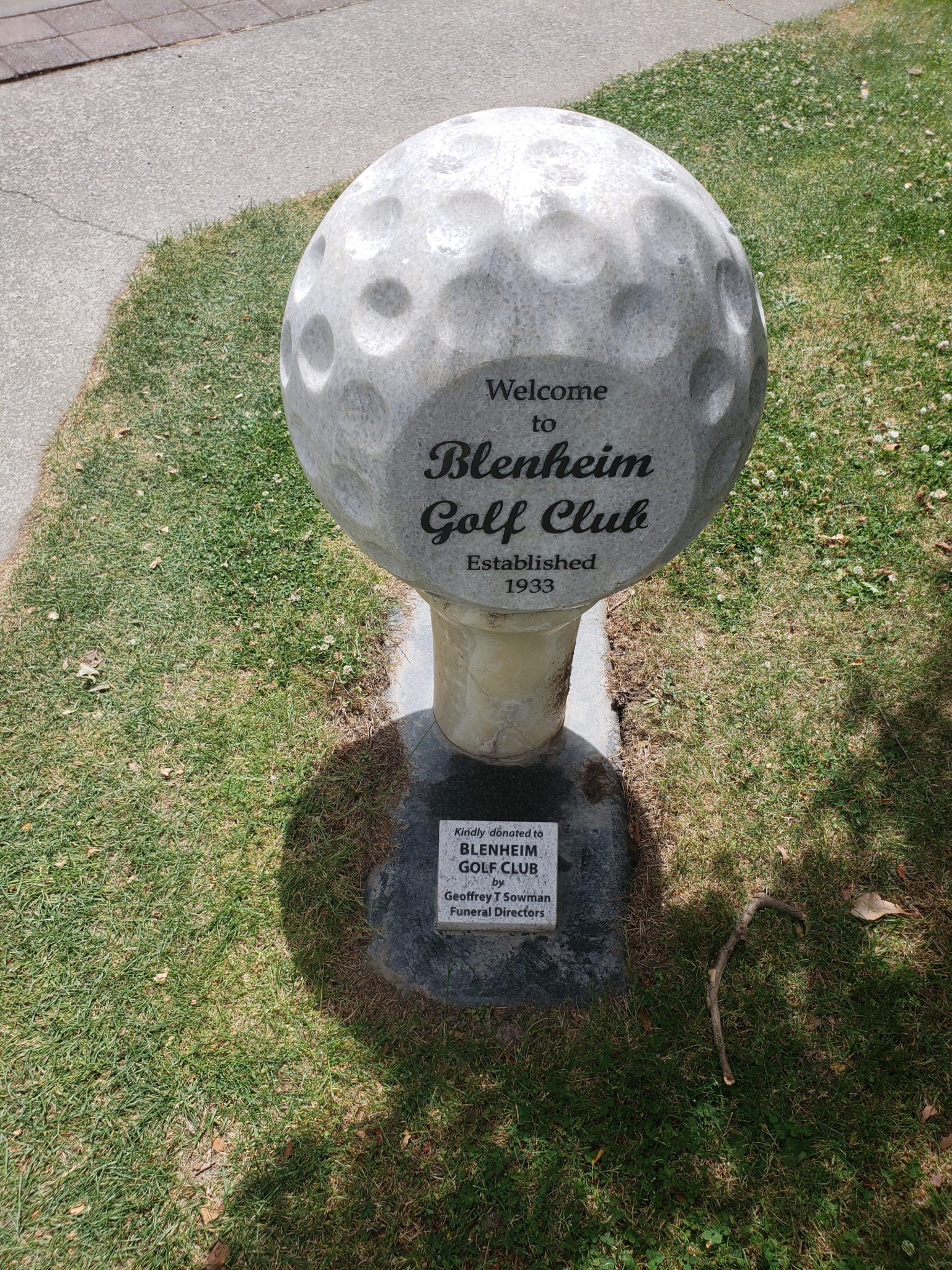 a stone golf ball on a tee