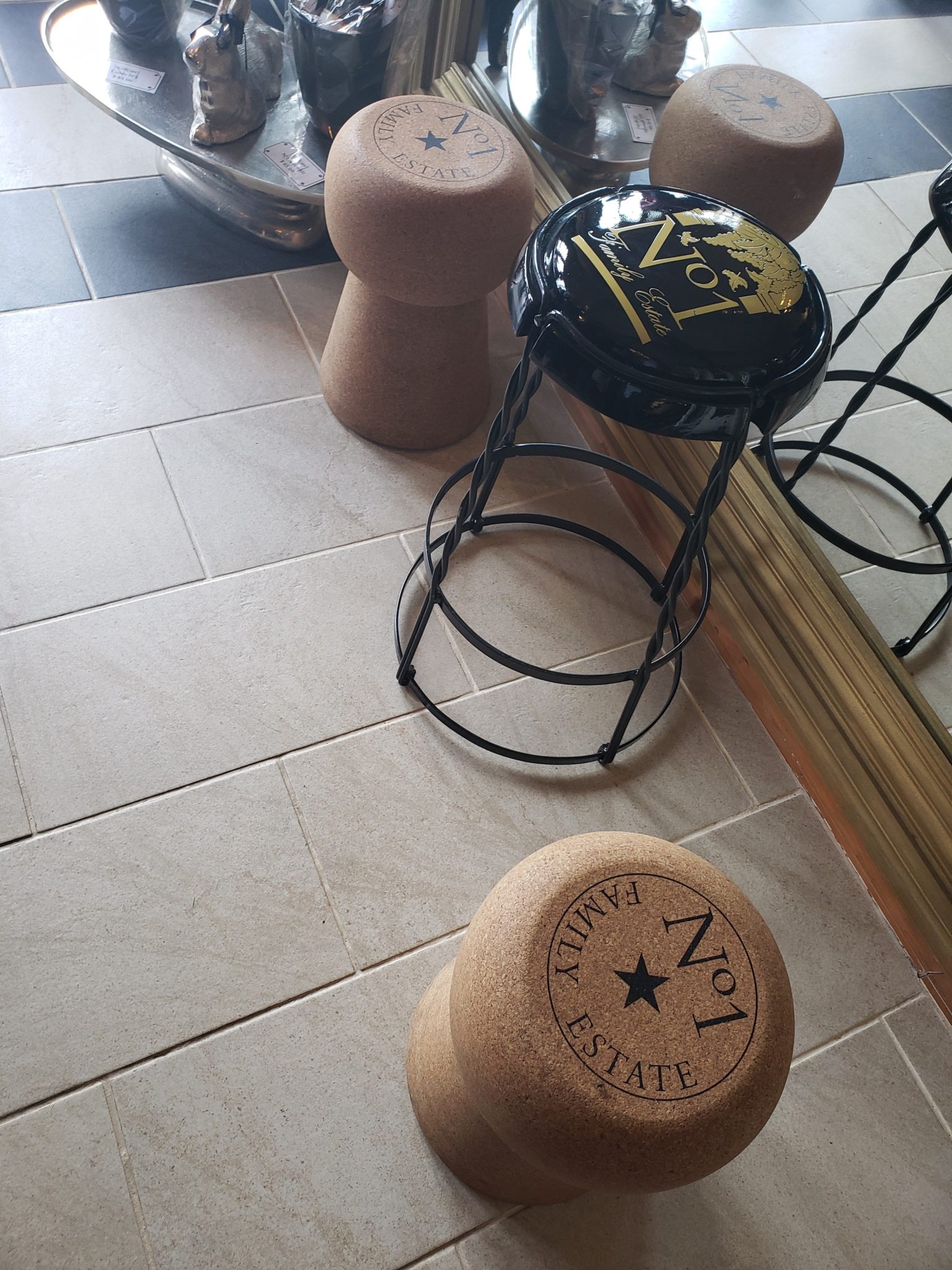 a group of stools on a tile floor