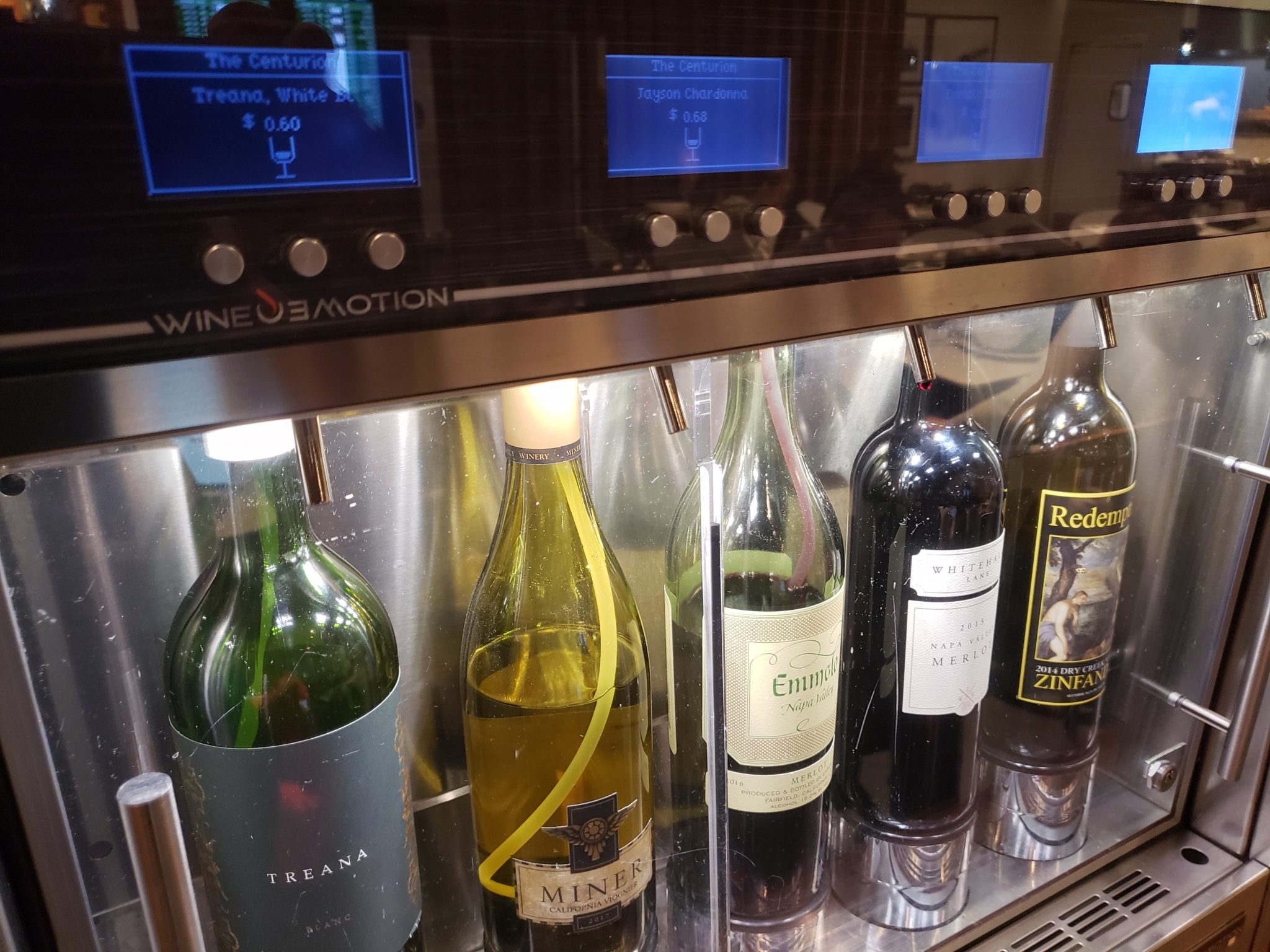 a group of bottles of wine in a cooler
