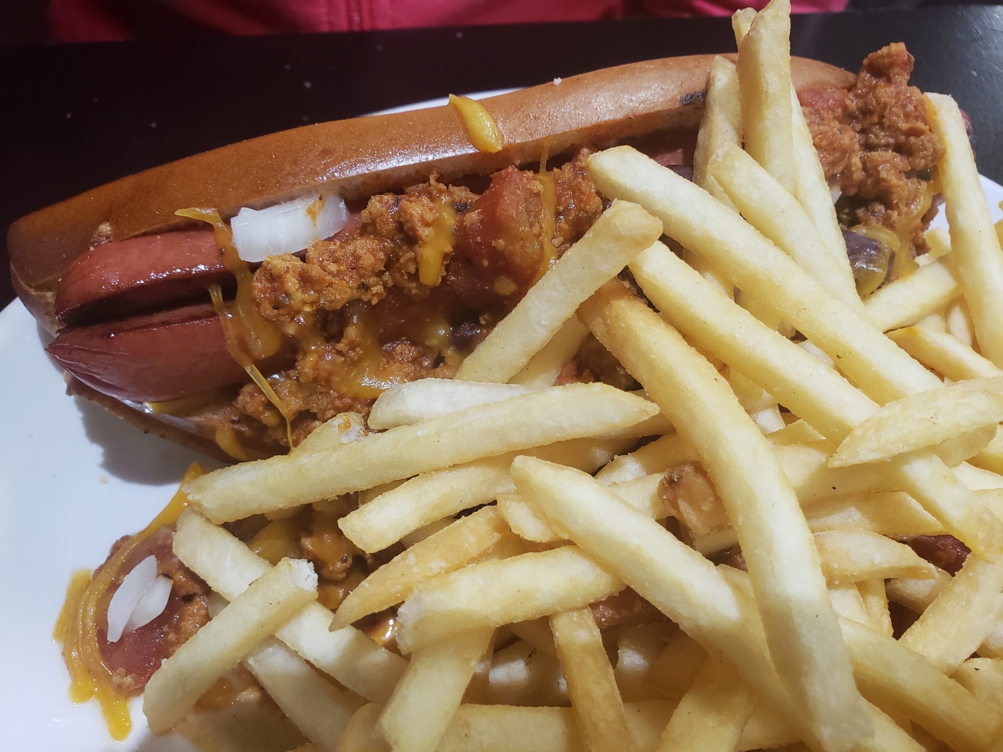 a hot dog and fries on a plate