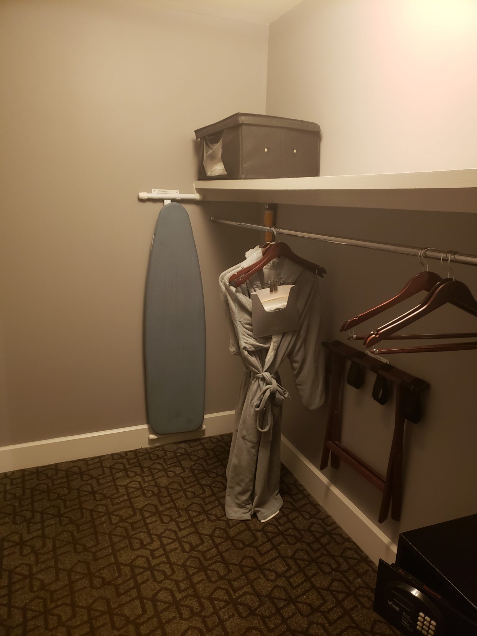 a shelf with clothes on it