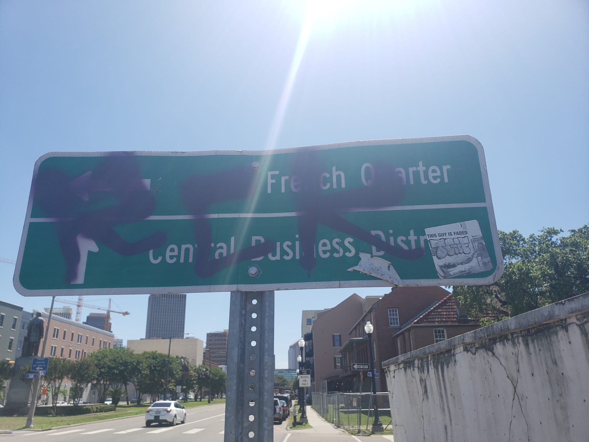 a street sign with graffiti on it