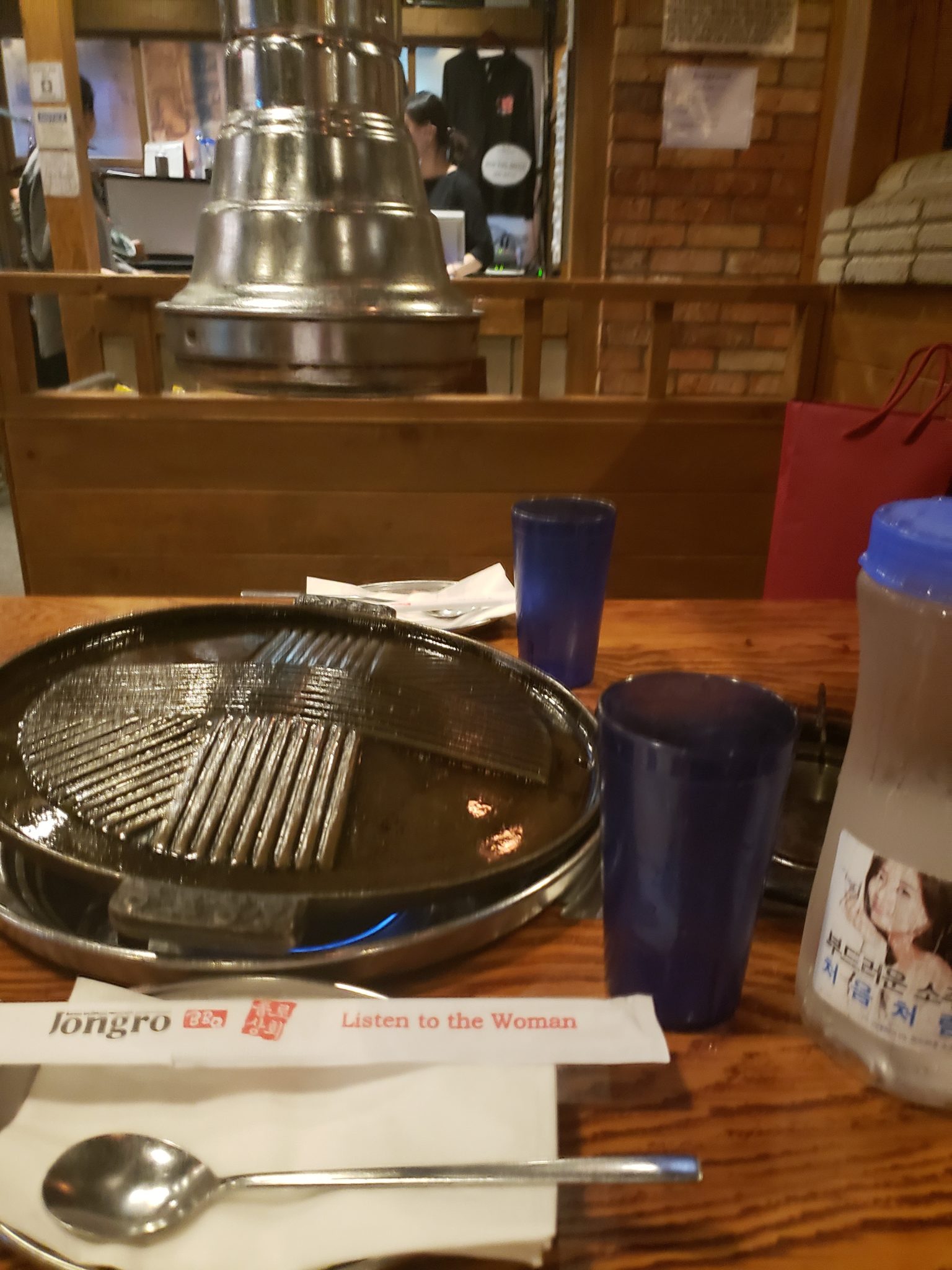 a table with a grill and glasses on it