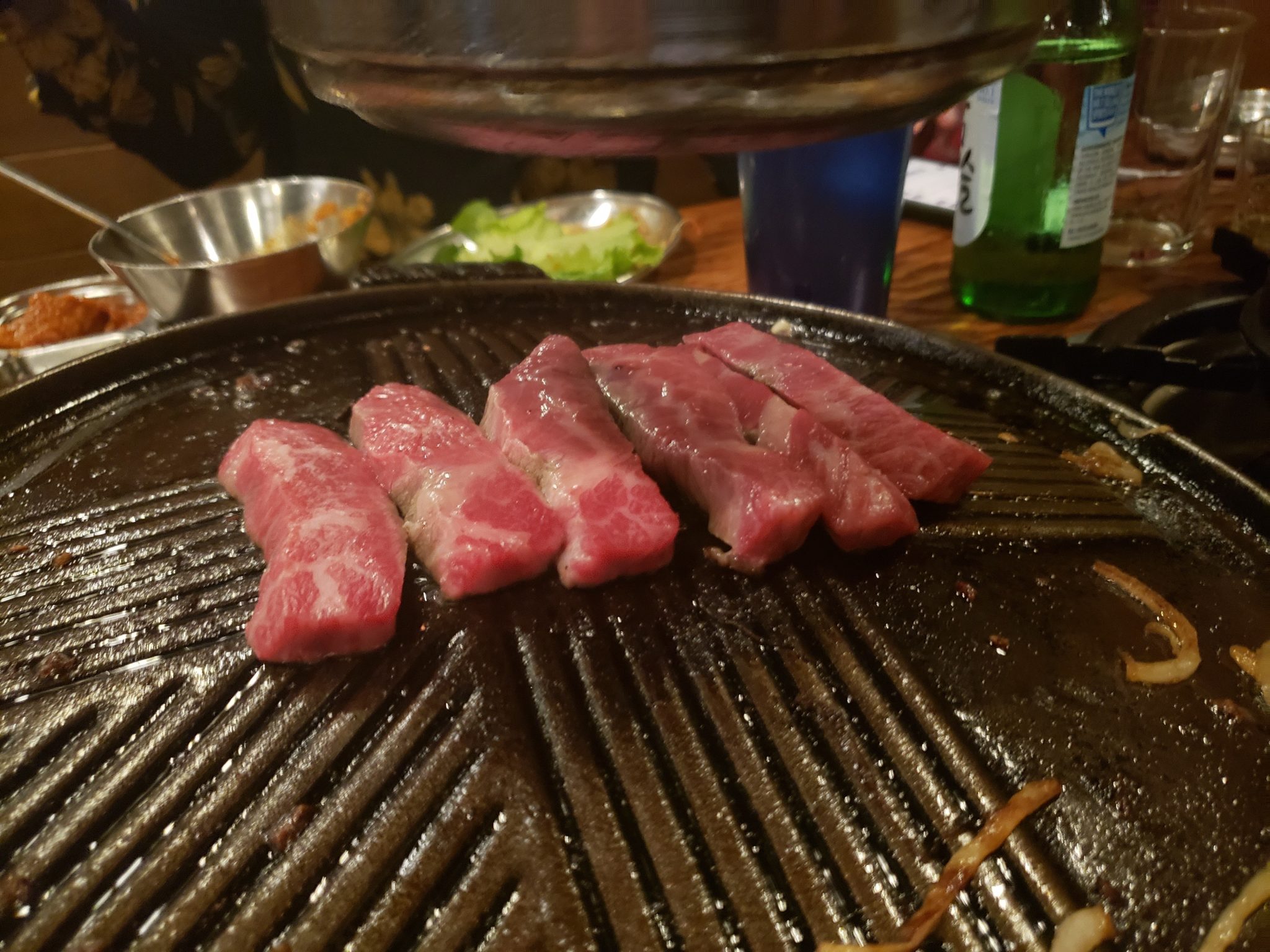 a group of meat on a grill