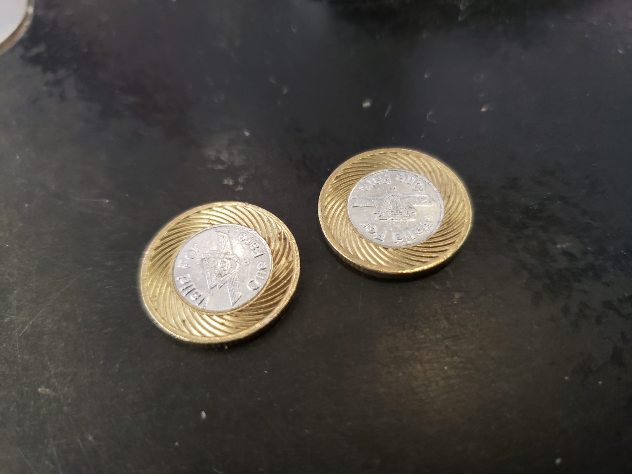 a pair of gold and silver coins