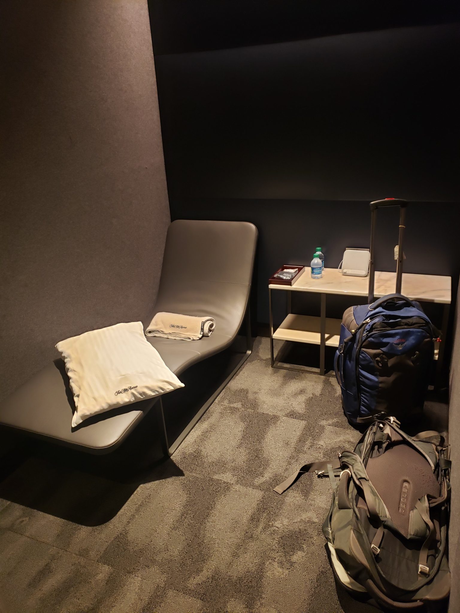 a chair and luggage in a room