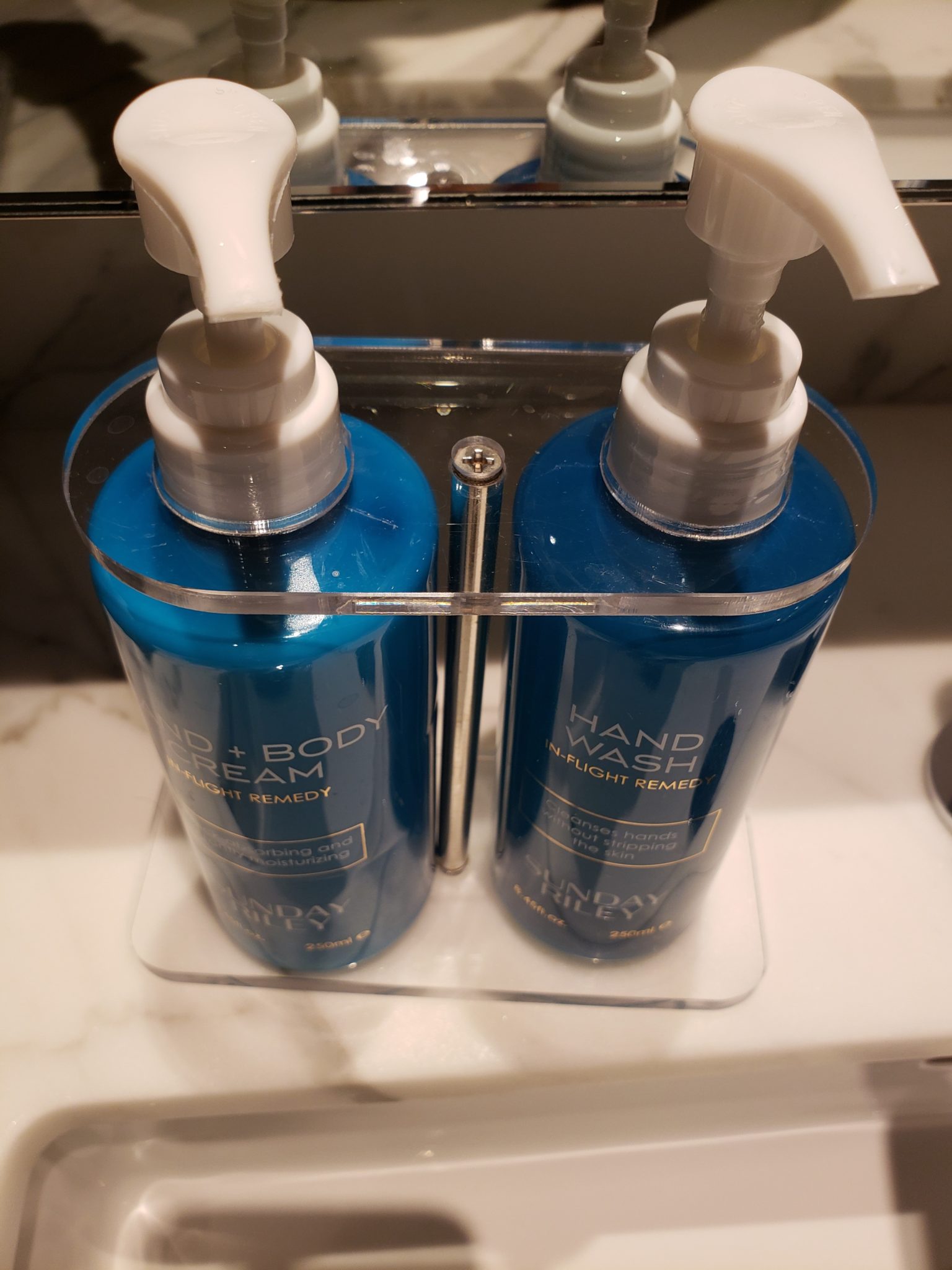 a couple of blue hand wash bottles