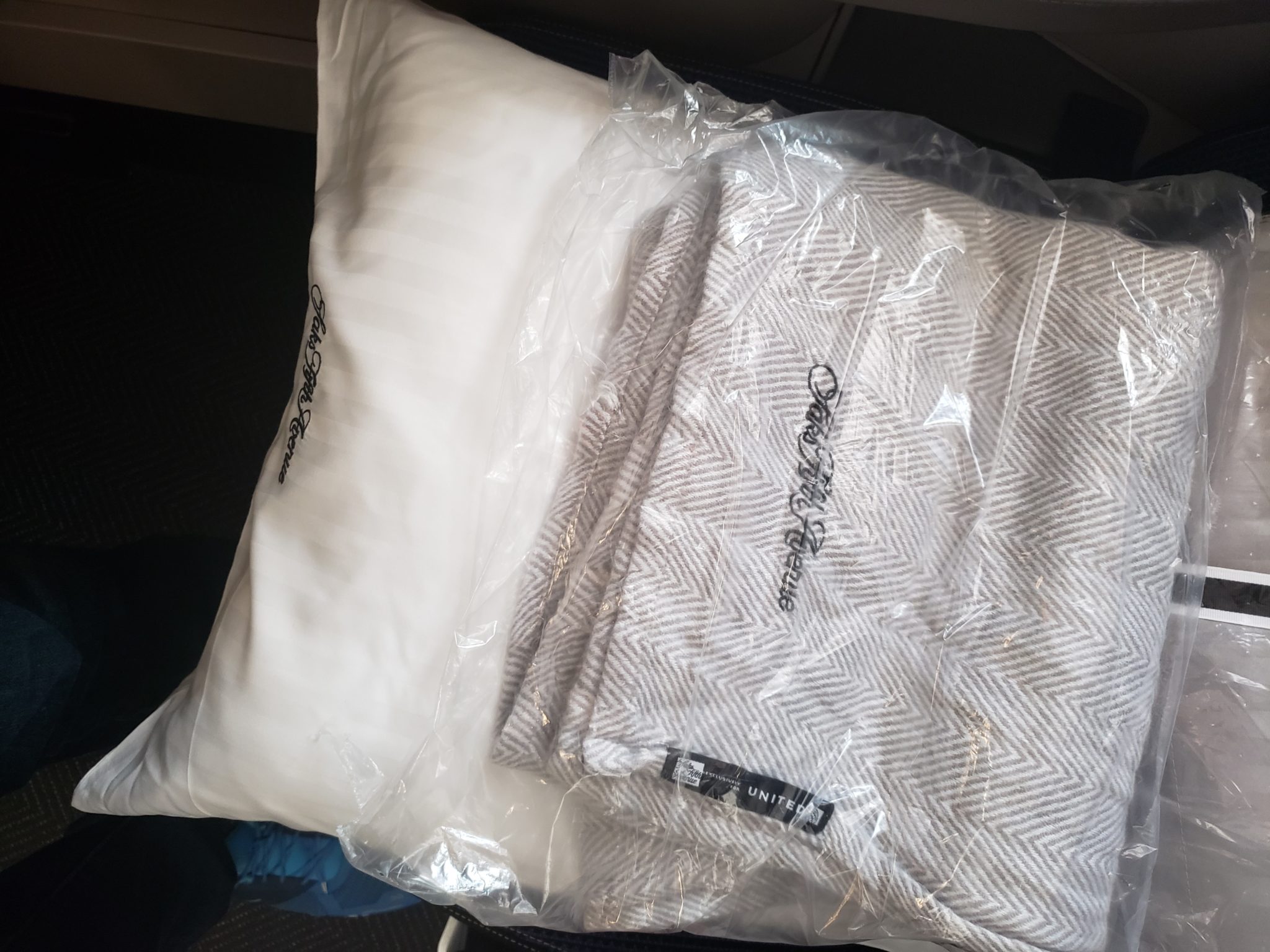 a white pillow with a white pillow in a plastic bag
