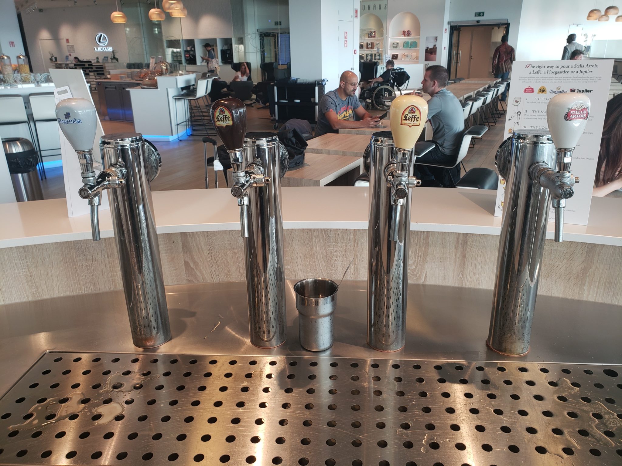 a group of beer taps in a bar